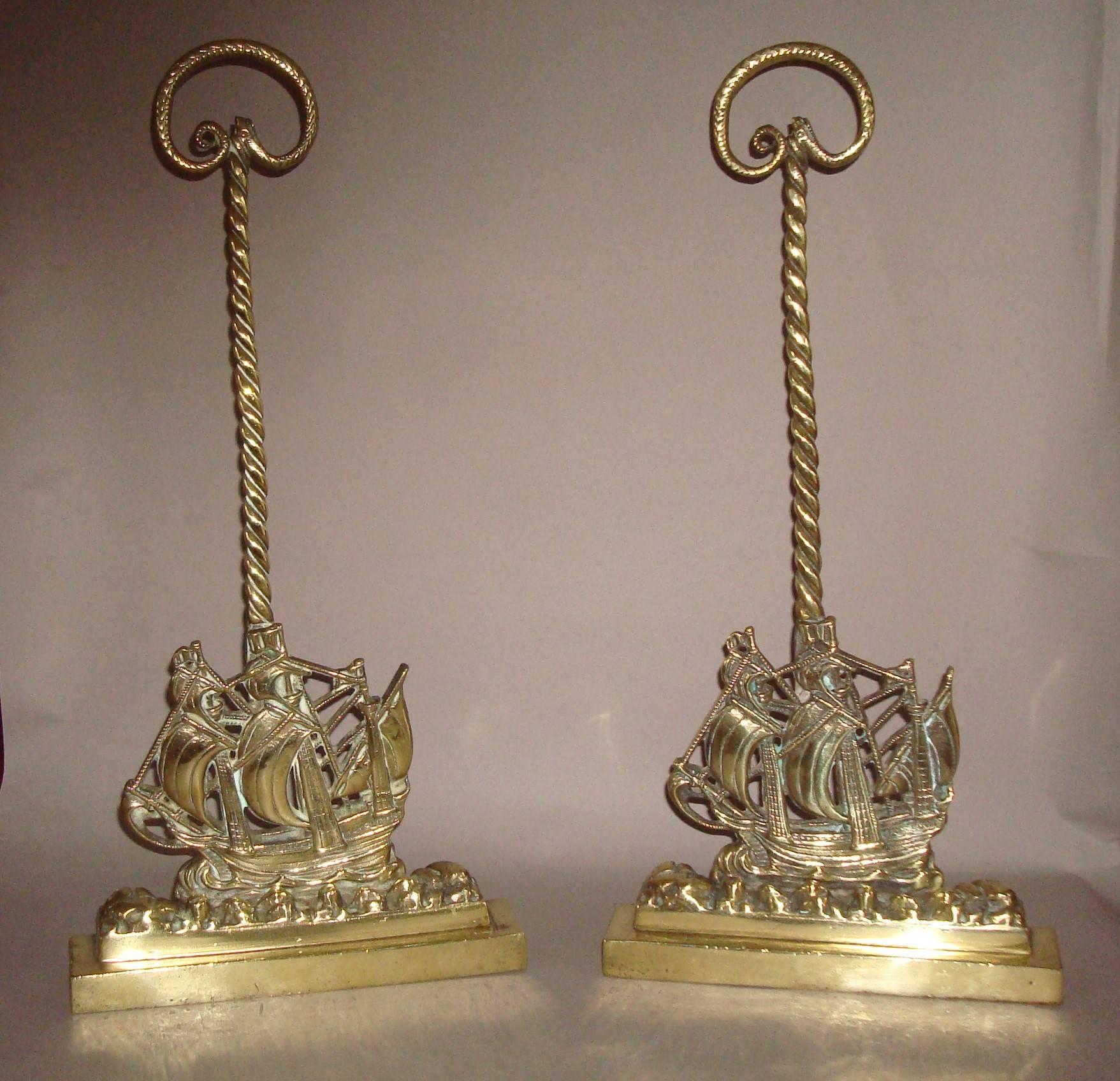 An interesting 19th century pair of brass doorstops or door porters of 'The Mayflower', the scroll handle being a serpent on a rope twist shaft, raised on 'The 'Mayflower' ship in full sail on a choppy sea, with a plinth base concealing its original
