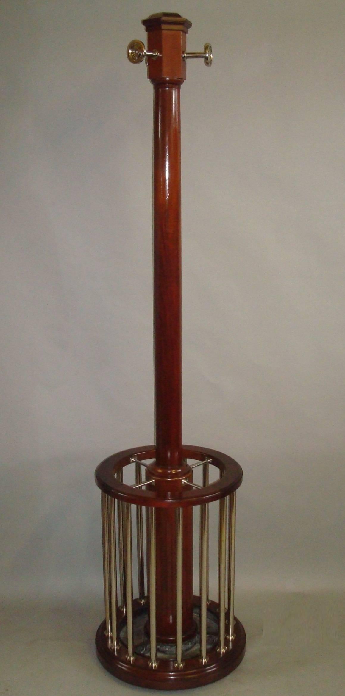 Stylish, early 20th century mahogany and chrome circular hall stand; for hats, coats, stick and umbrellas. In the Art Deco manner and of unusual and very stylish design.

The bold mahogany central column headed with a hexagonal moulded capital