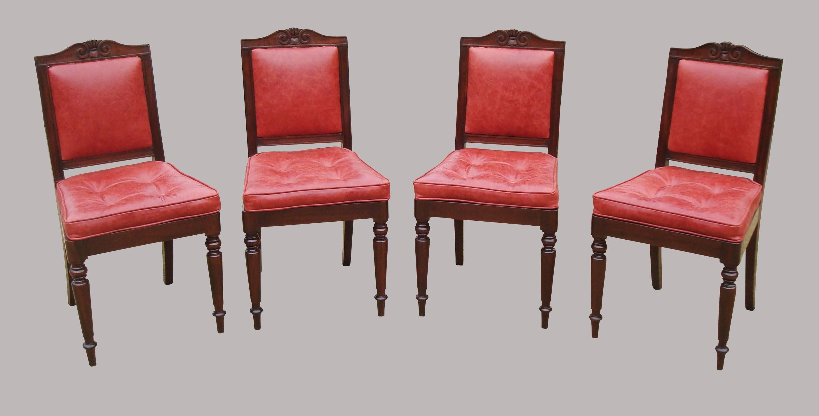 Good Gillows late Regency set of four mahogany side chairs, stamped 'Gillows Lancaster' and newly upholstered in good quality red leather; the shaped top rail with a carved scroll cresting, above an upholstered back panel. The buttoned squab