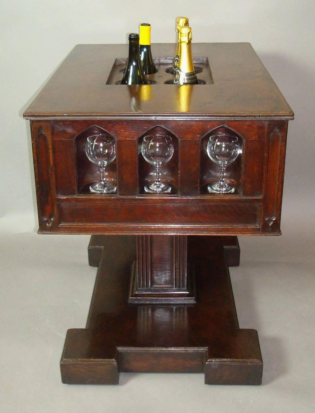 19th century Gothic oak champagne or wine cooler table; this very unusual table was almost certainly made as a wine or champagne tasting table for a Gothic influenced French chateaux. The rectangular top with a moulded edge and a central lift out