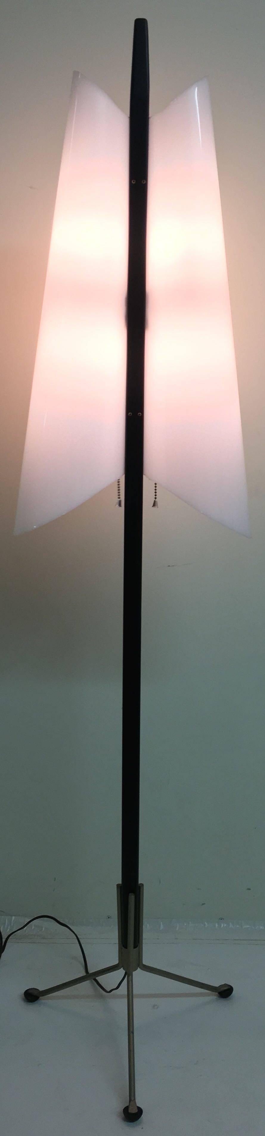 A really unusual Danish floor lamp by Hans Agne jakobsson, circa late 1950s. It’s in wonderful condition with perfectly duplicated new lampshades. The main shaft is ebonized hardwood and the three-legged metal base has cool little black pod feet.