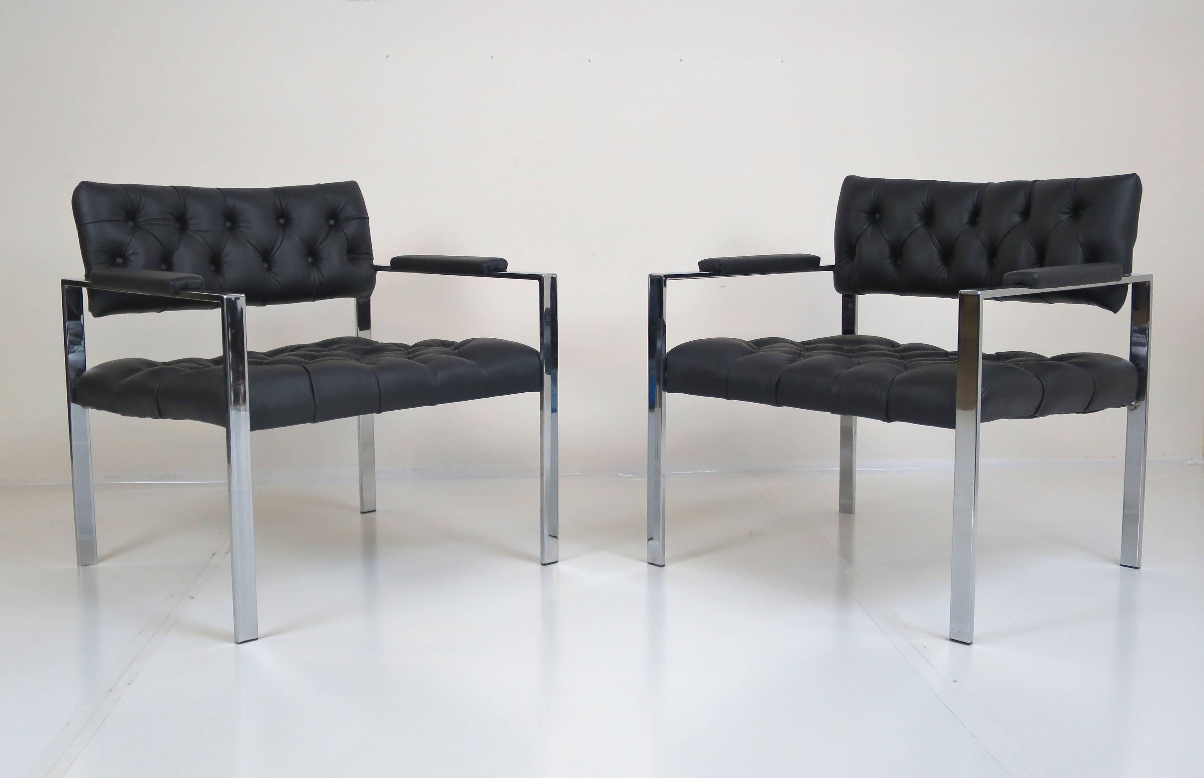 Pair of leather tufted lounge chairs by Harvey Probber. Comfort and style, this sizable pair of lounge chairs has everything that's needed and nothing more. Original chrome frames show well and clean recent upholstery in black hides. Chairs are