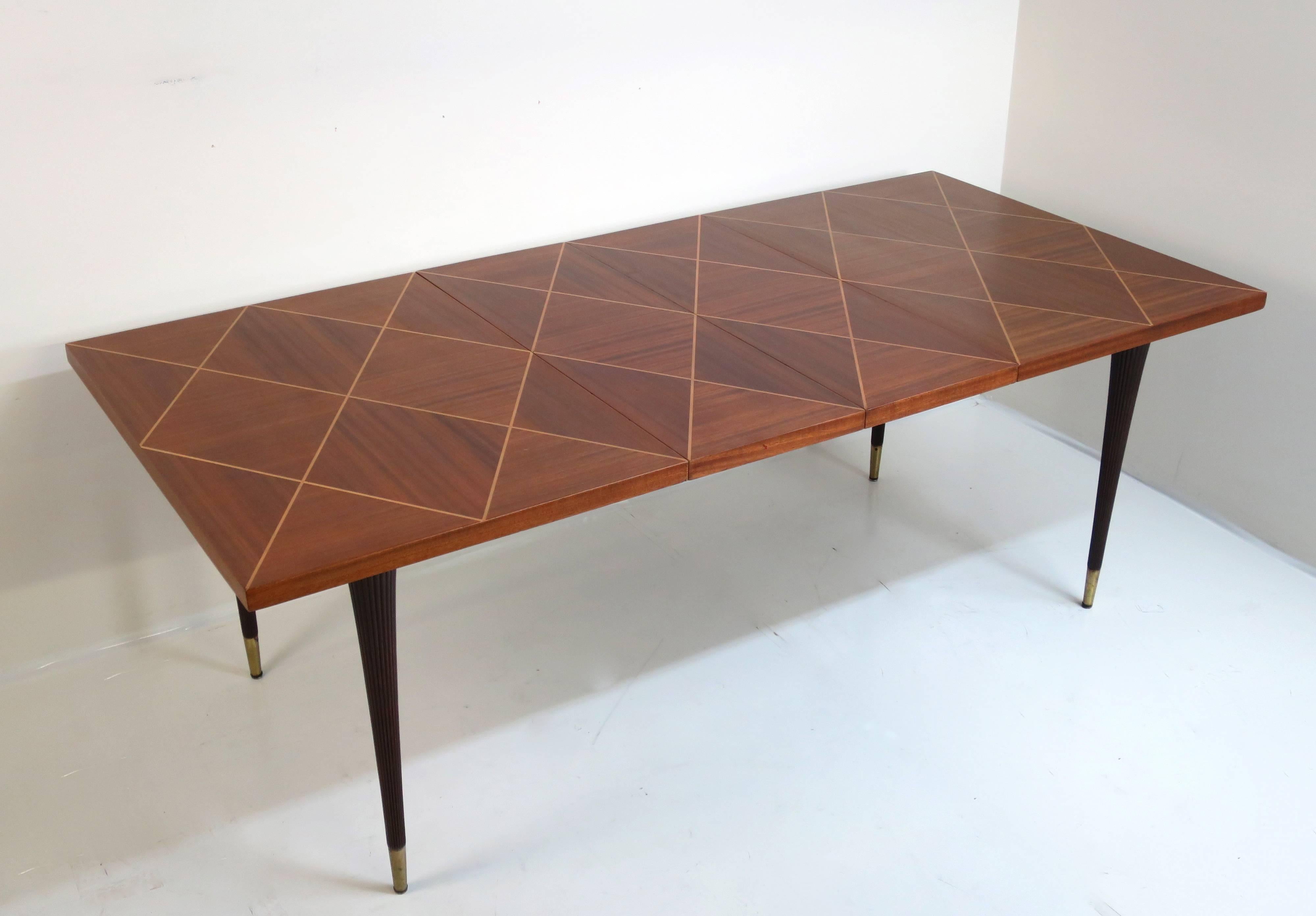 Tommi Parzinger dining table by Charak.
Tables measures 40
