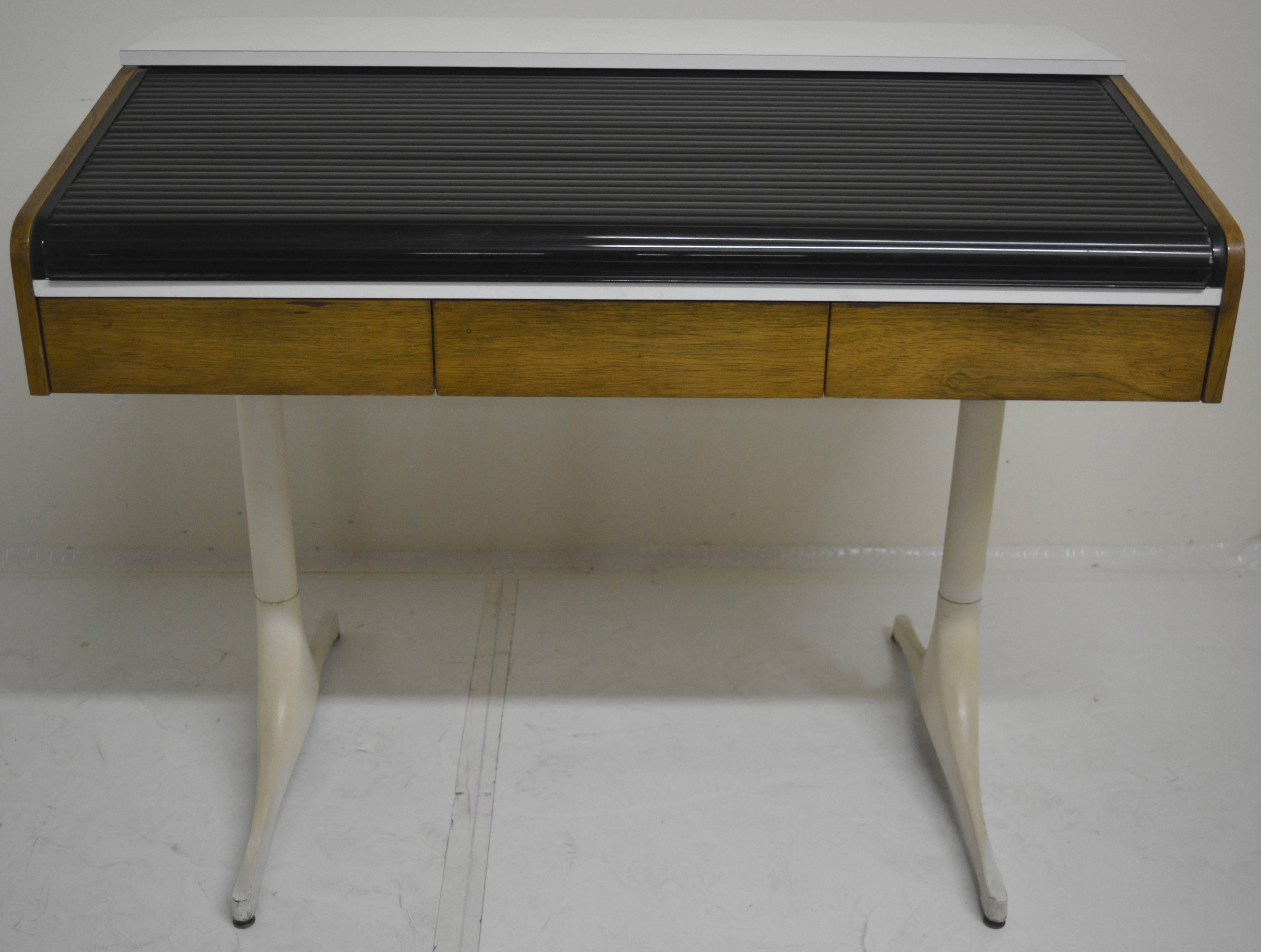 Very Rare and offered by Herman Miller for only two years and produced by special order, the Roll Top Pedestal desk is one of Nelson's rarest designs. Made of rosewood, laminate, and enameled aluminum with a cast base, this desk is in remarkable