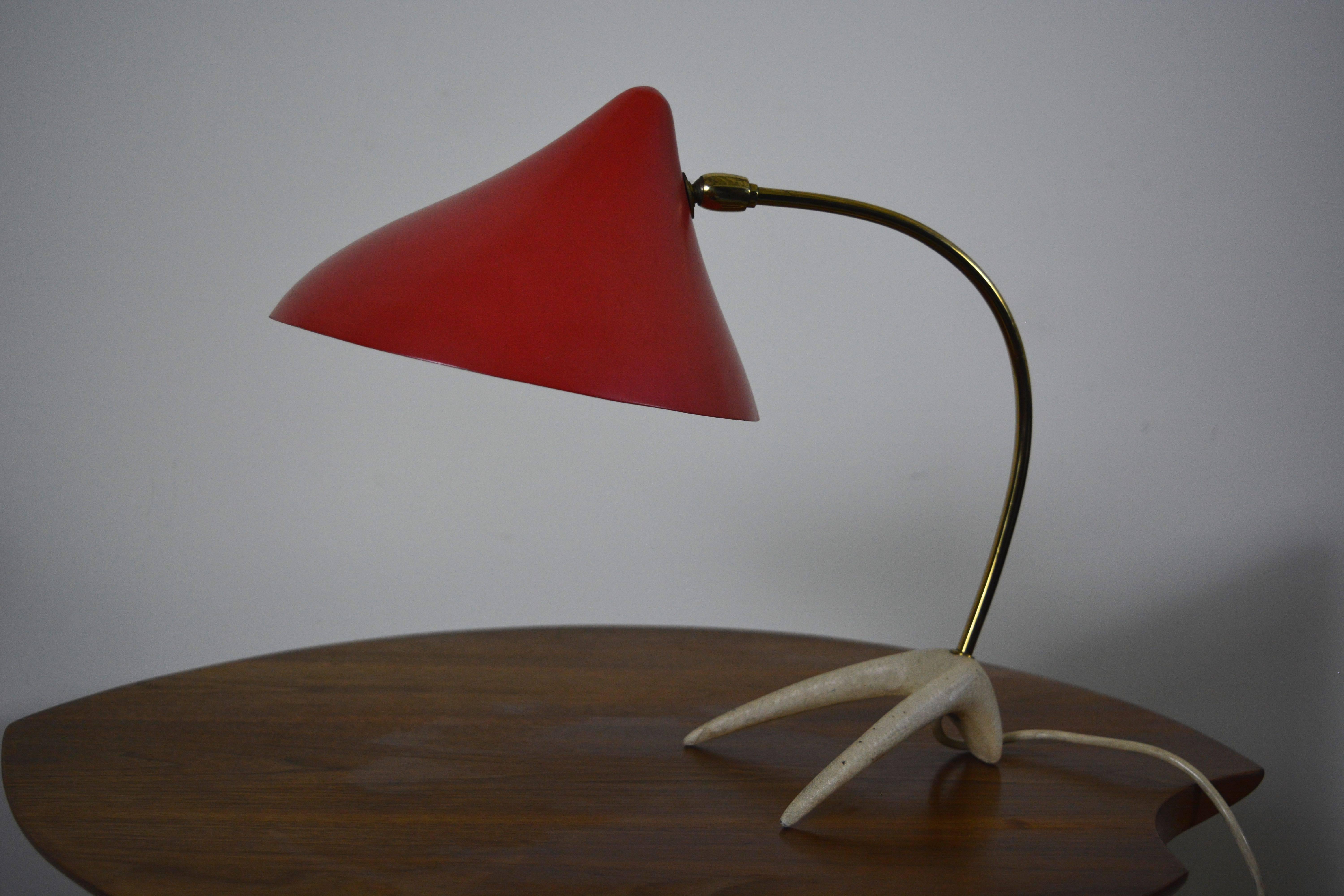 Modernist desk lamp by Louis Kalff in very nice original condition. Patina to brass consistent as shown in pictures. In addition, the aluminum shade still retains its original finish in excellent original condition.