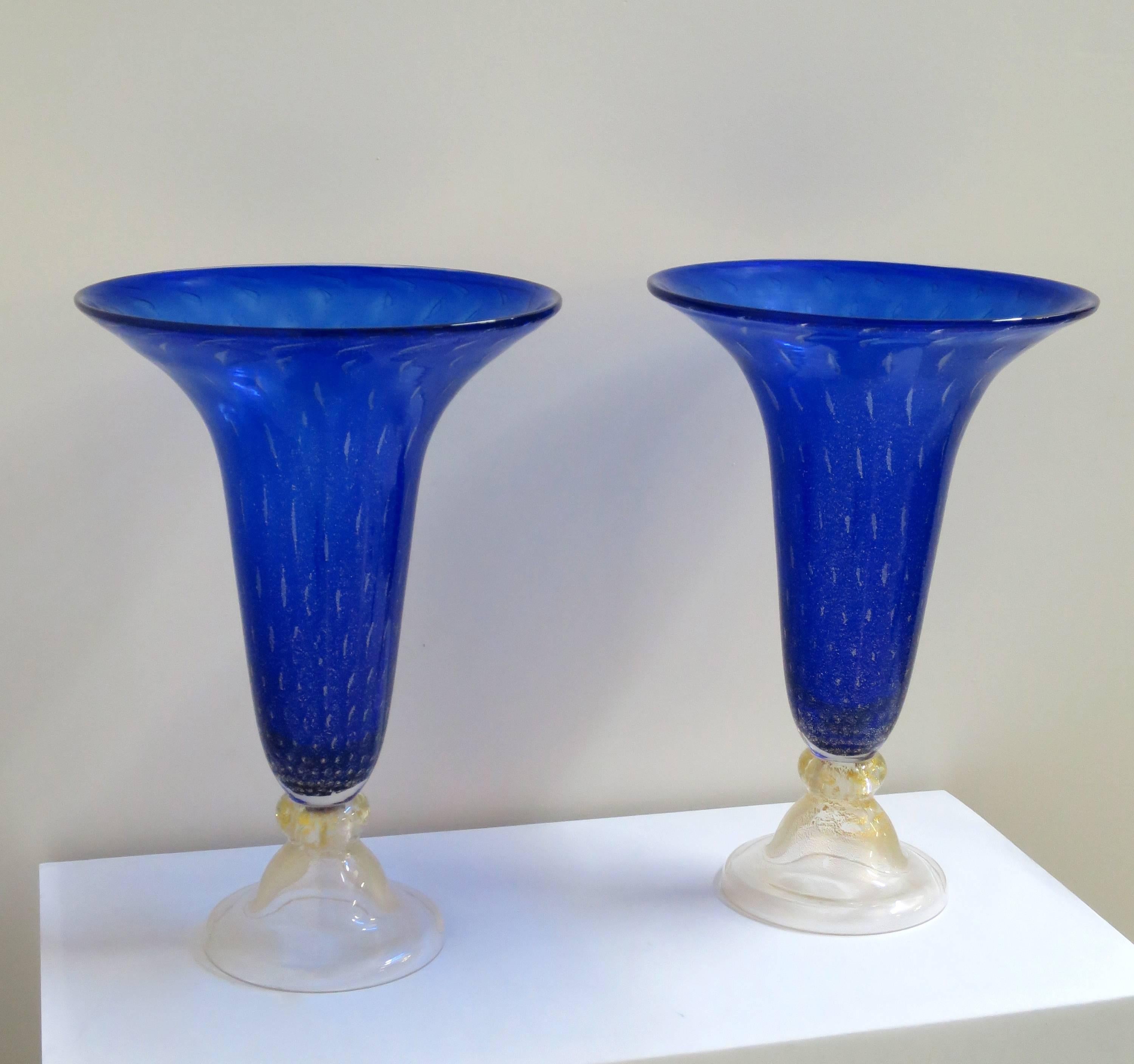 Exquisite pair of large royal blue Murano glass vases with controlled bubble and gold fleck. At 18 inches tall, these vases are tall enough to anchor a credenza or contemporary sofa table, a scale that is less common. Vibrant color is sure to bring