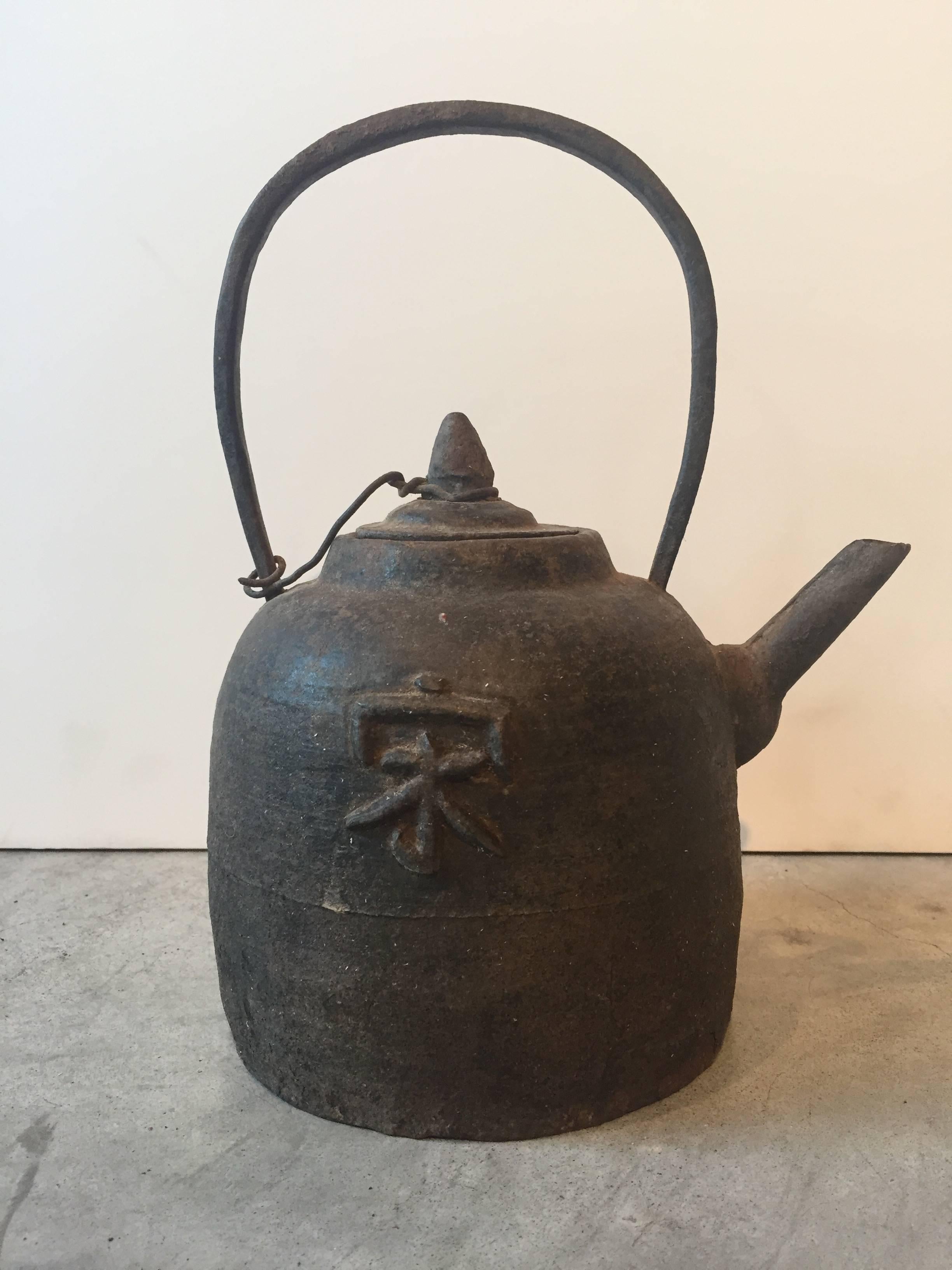 An unusual antique Chinese cast iron teapot with a large Chinese character in the center. From Shanxi Province, circa 1880.
M676.