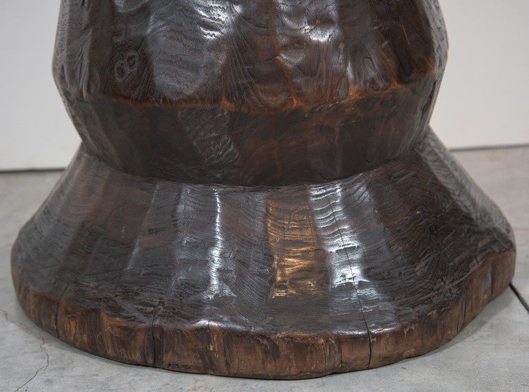 An unusually shaped teak agricultural stool carved from a single piece of wood. Unique in form and beautifully finished. Minor crack on one side, see photos. Java Indonesia, circa 1940s.
S532.