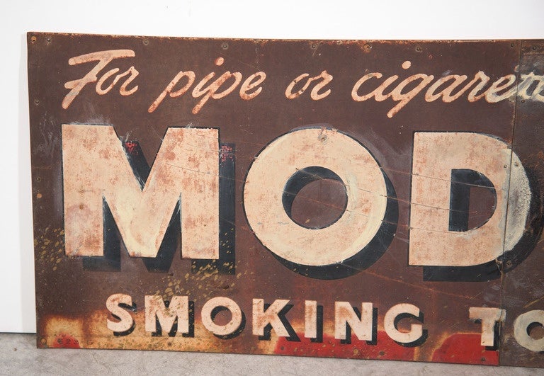 A great hand-painted 1940s tin on wood advertising sign. Nicely faded, with striking graphic images,
USA, circa 1940s.
P104.