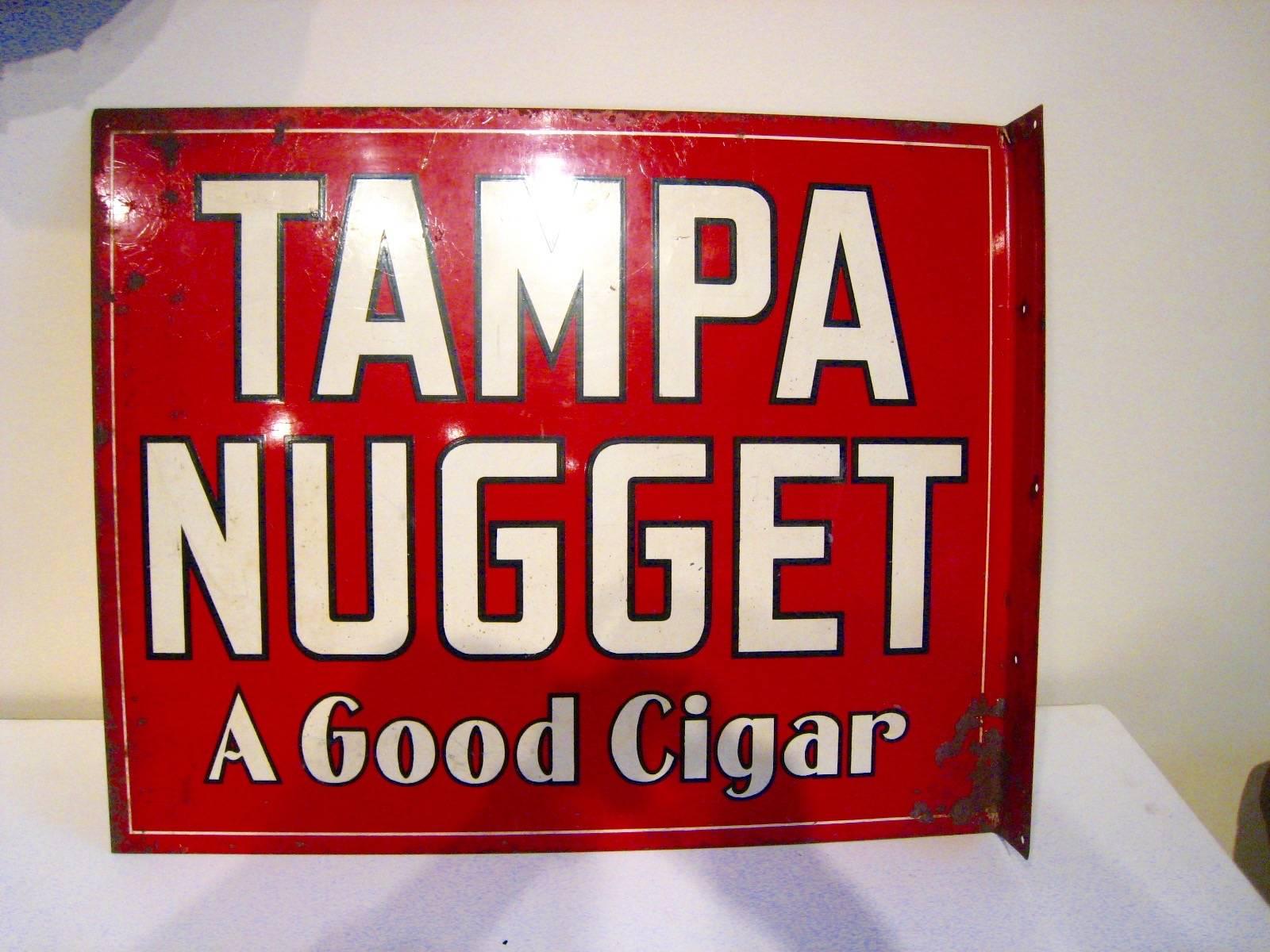 A striking Tampa Nugget painted metal cigar sign with the simple slogan 