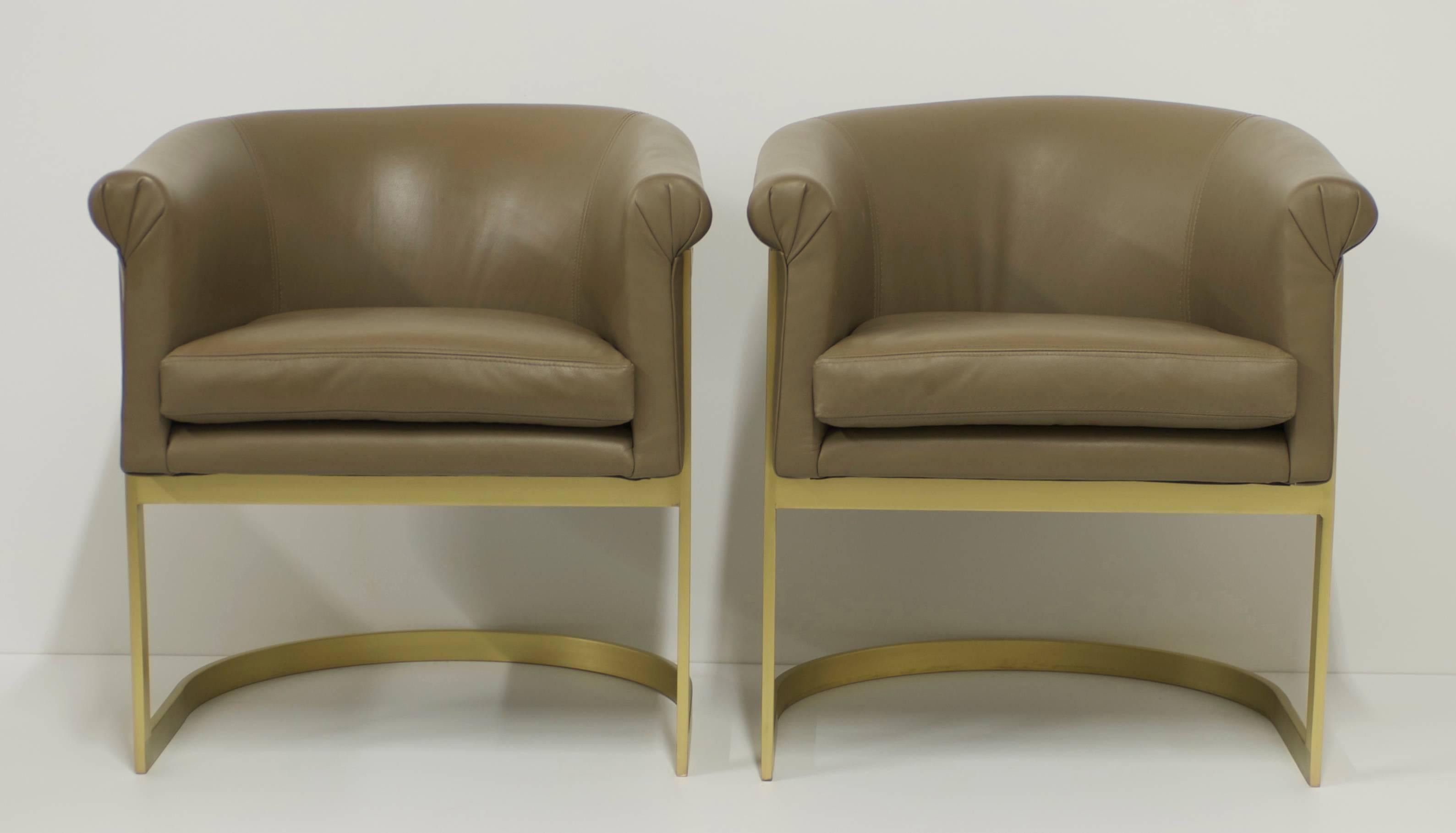 This pair of cantilevered barrel backed petite sized lounge or occasional chairs have been completely refurbished. The metal has been replated in matte brass and the upholstery has been expertly redone in a supple soft rich sage light olive color