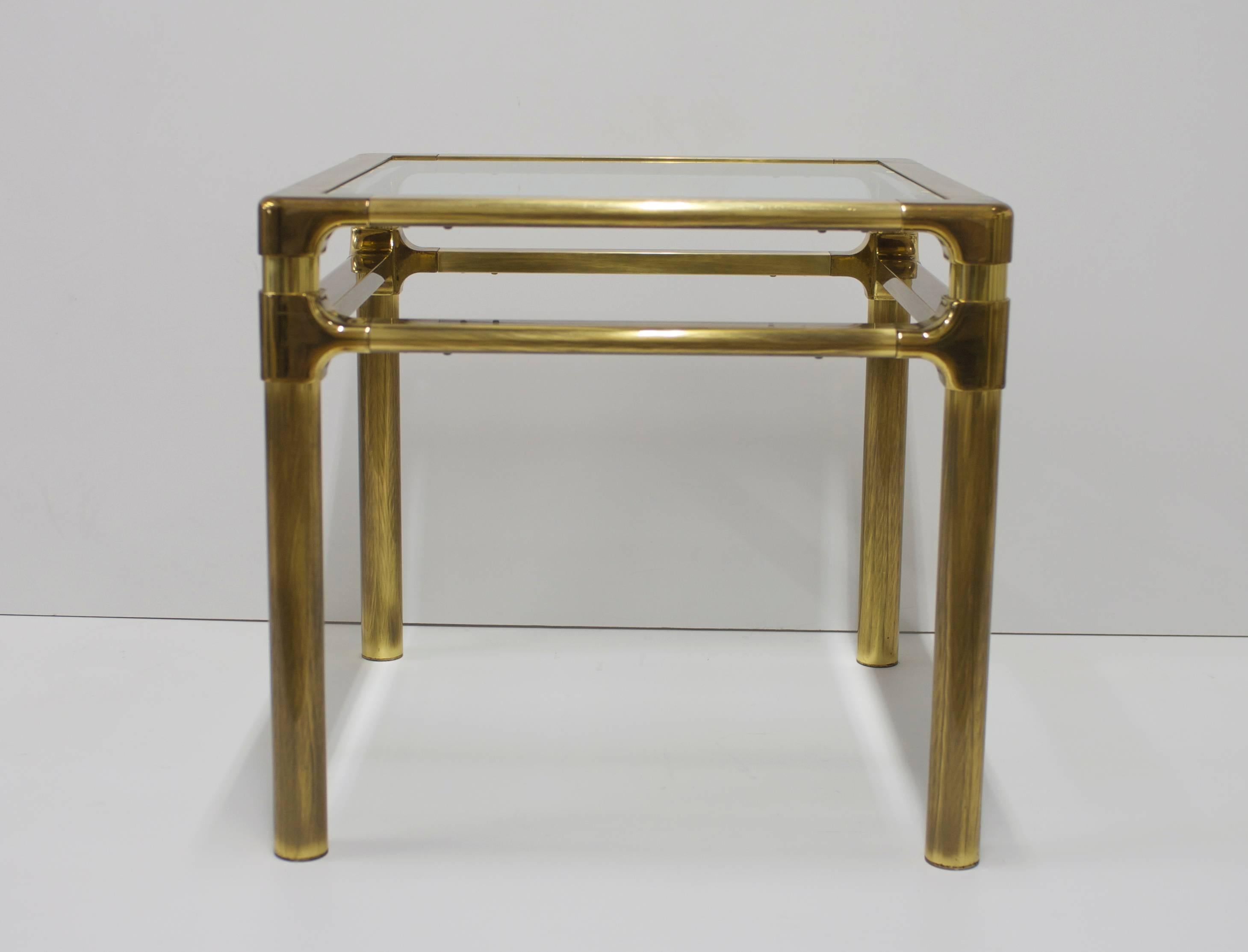 This quality brass side or occasional table has aged to the perfect patina. 
The brass is in excellent vintage condition. The table is substantial and heavy, a quality made piece. The beveled glass is new so is in excellent condition.  