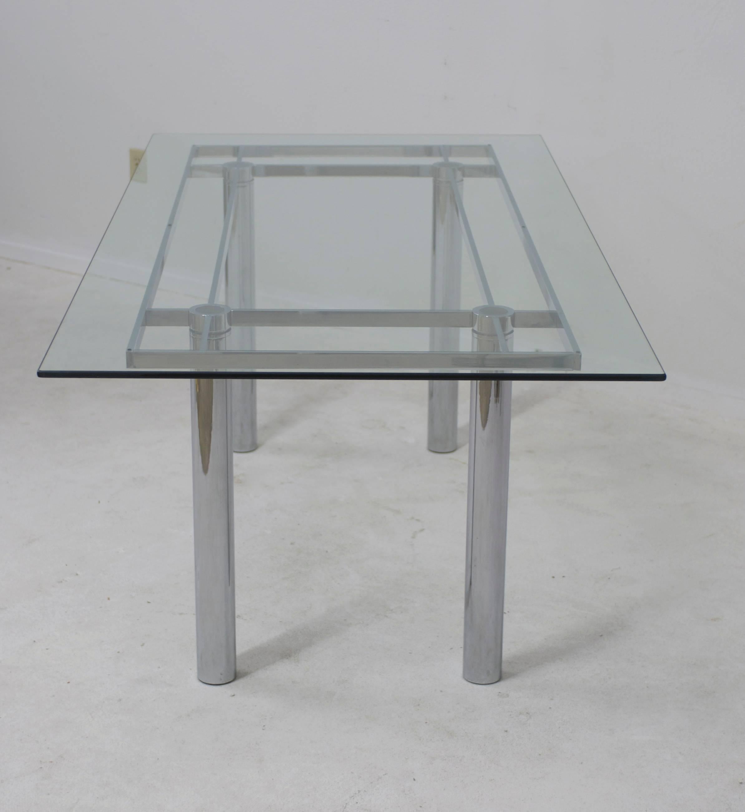 The Tobia Scarpa 'Andre' table or desk originally designed for Gavina and later produced by Knoll. Made of steel with a polished chrome finish this table can be shipped with or without the glass. The table base size is 69