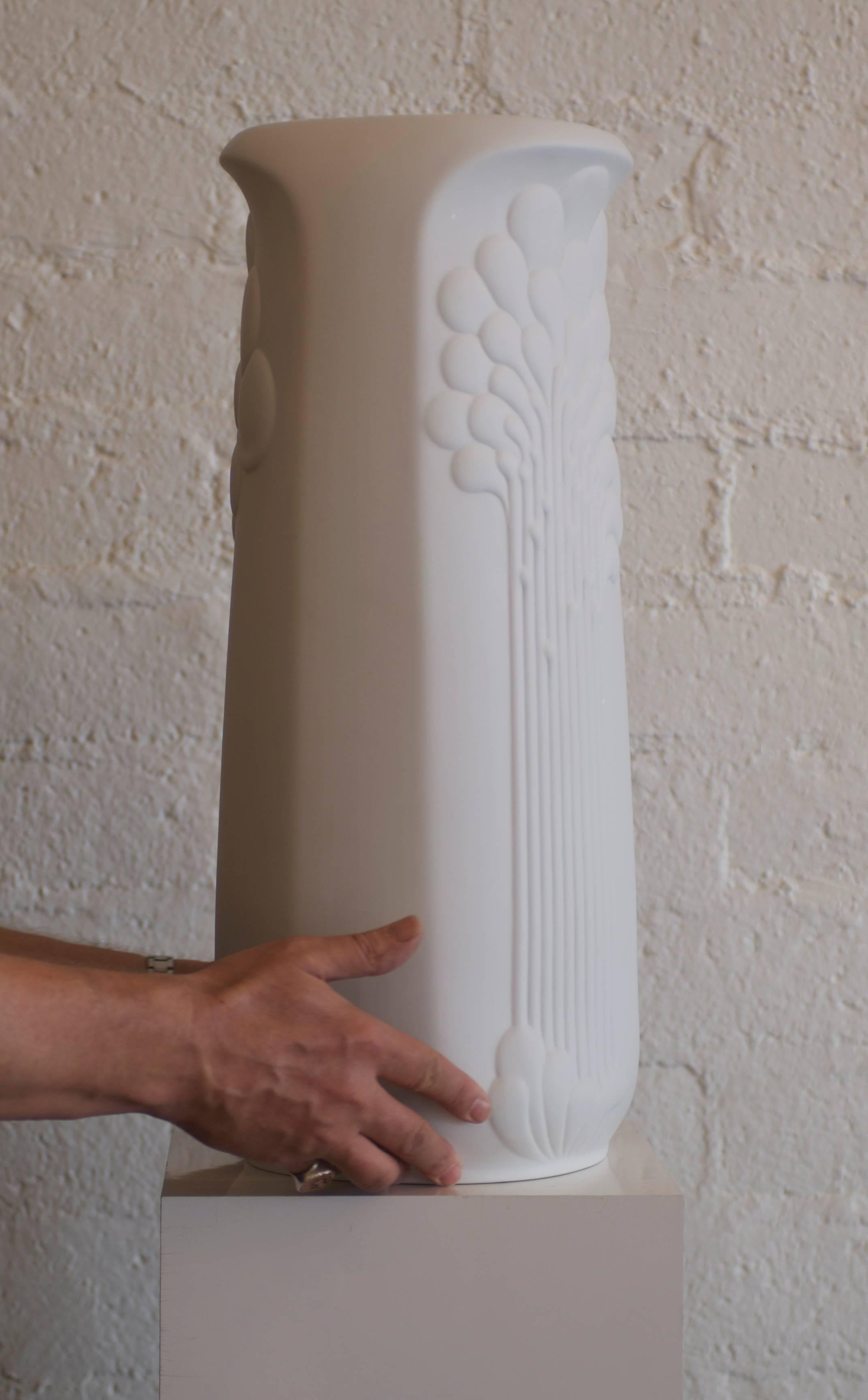 This 1970s op art matte white bisque designed by Manfred Frey and signed M. Frey is made of matte white bisque porcelain on the outside a glazed interior. Manfred Frey was an in house designer for Kaiser in Germany. The porcelain floor vase is quite