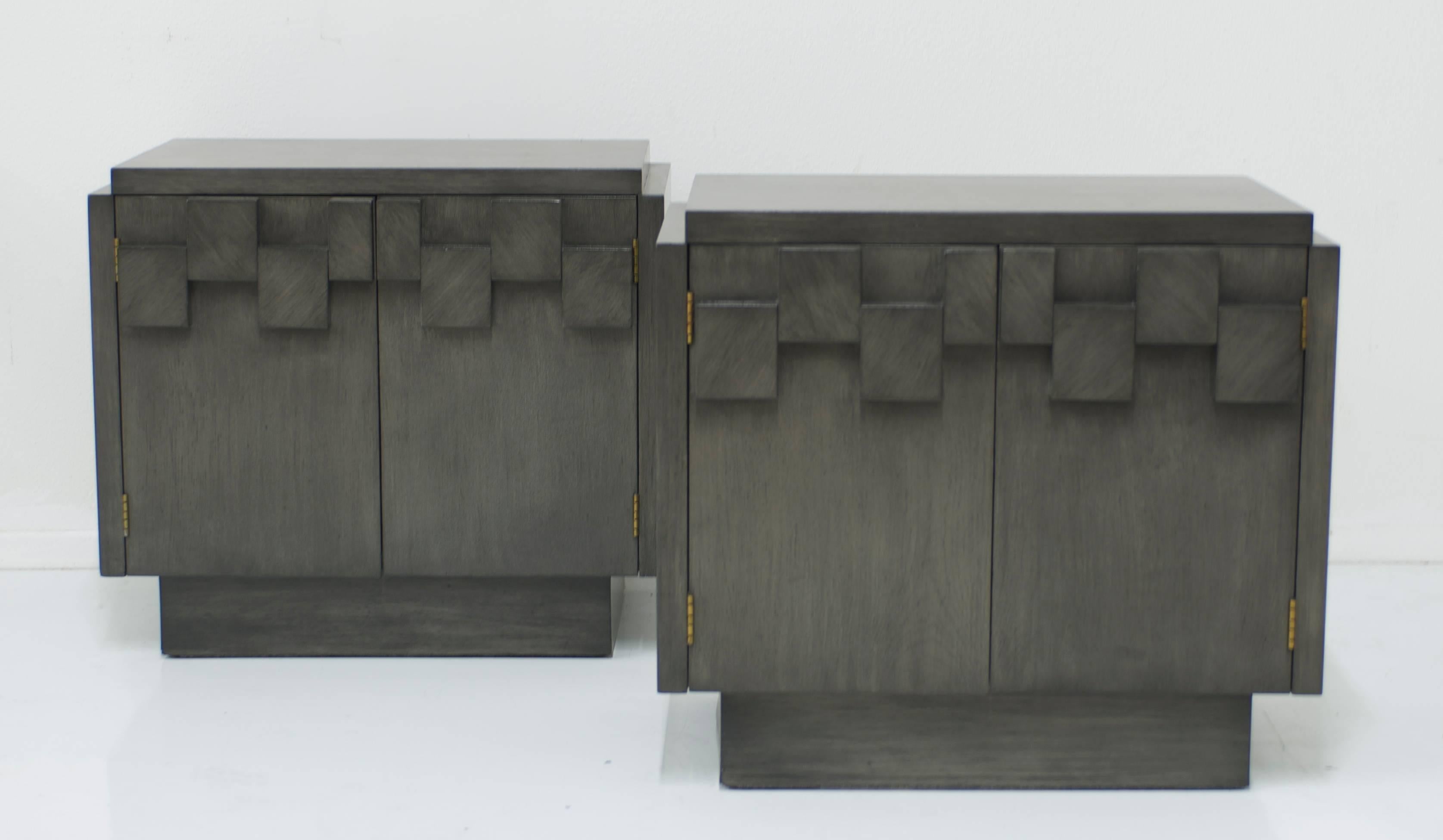 These brutalist bedside tables manufactured by Lane have been refinished in a custom charcoal grey finish that allows the grain of the oak show through. The result is handsome and effective in featuring the geometry on the facia of the drawer
