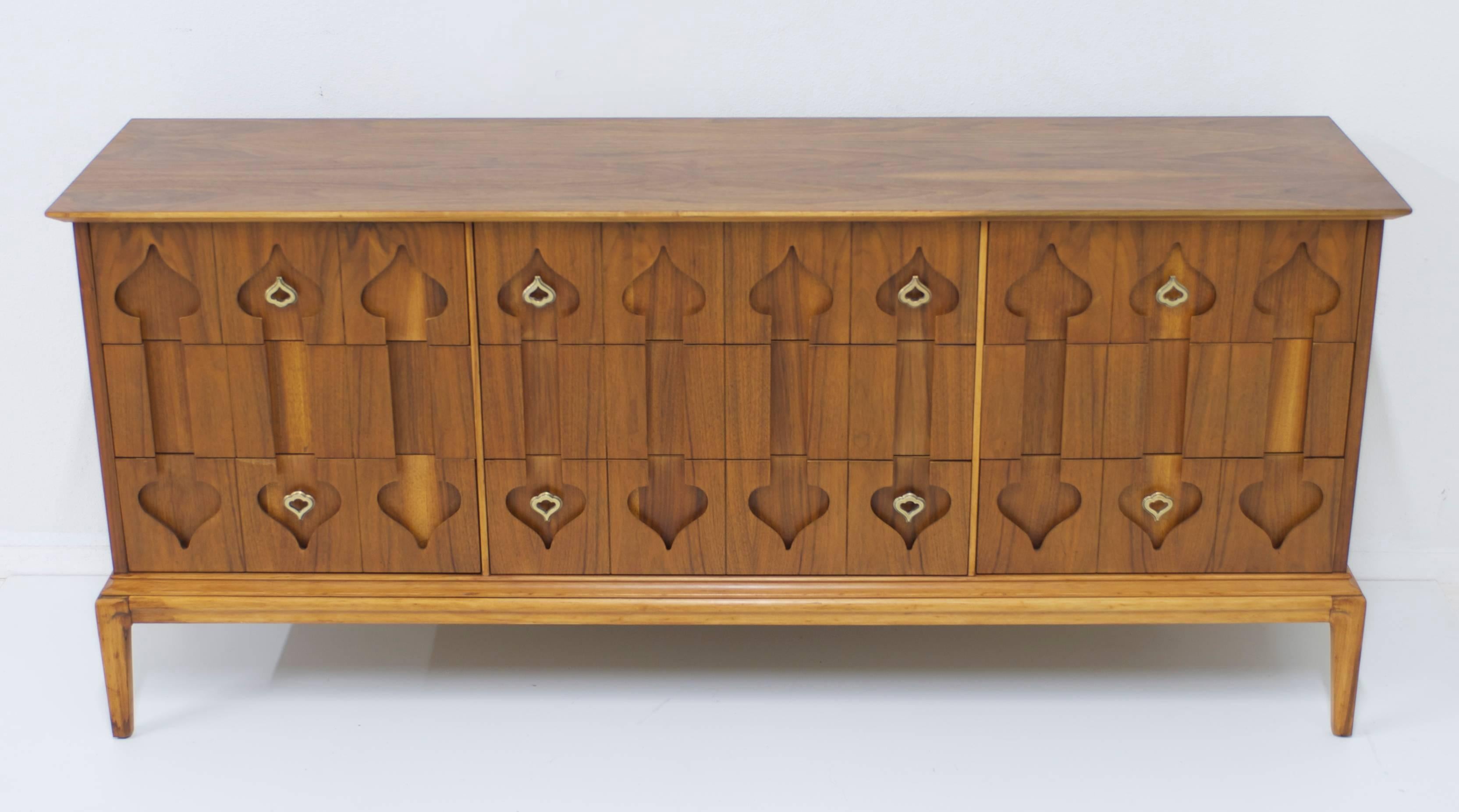 This nine-drawer Moroccan style dresser has matte nickel pulls.
The walnut wood has been gently restored so it is in showroom condition.