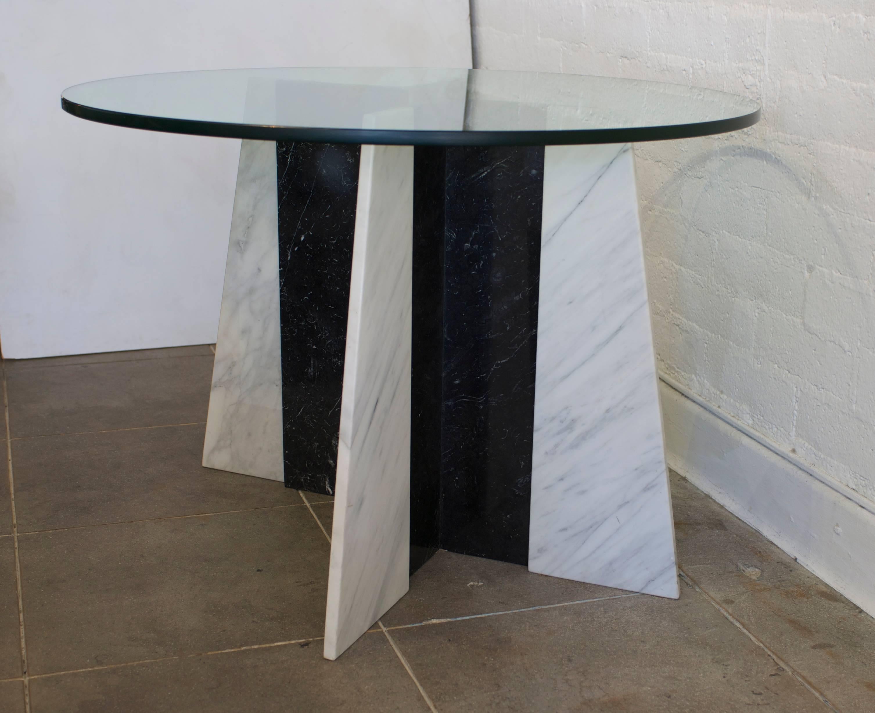 This versatile Postmodern marble table base currently has a round glass top on it but it could take a larger piece of glass in a rectangular shape to become a desk, console or larger table. The bases can be faced in either direction. The bases