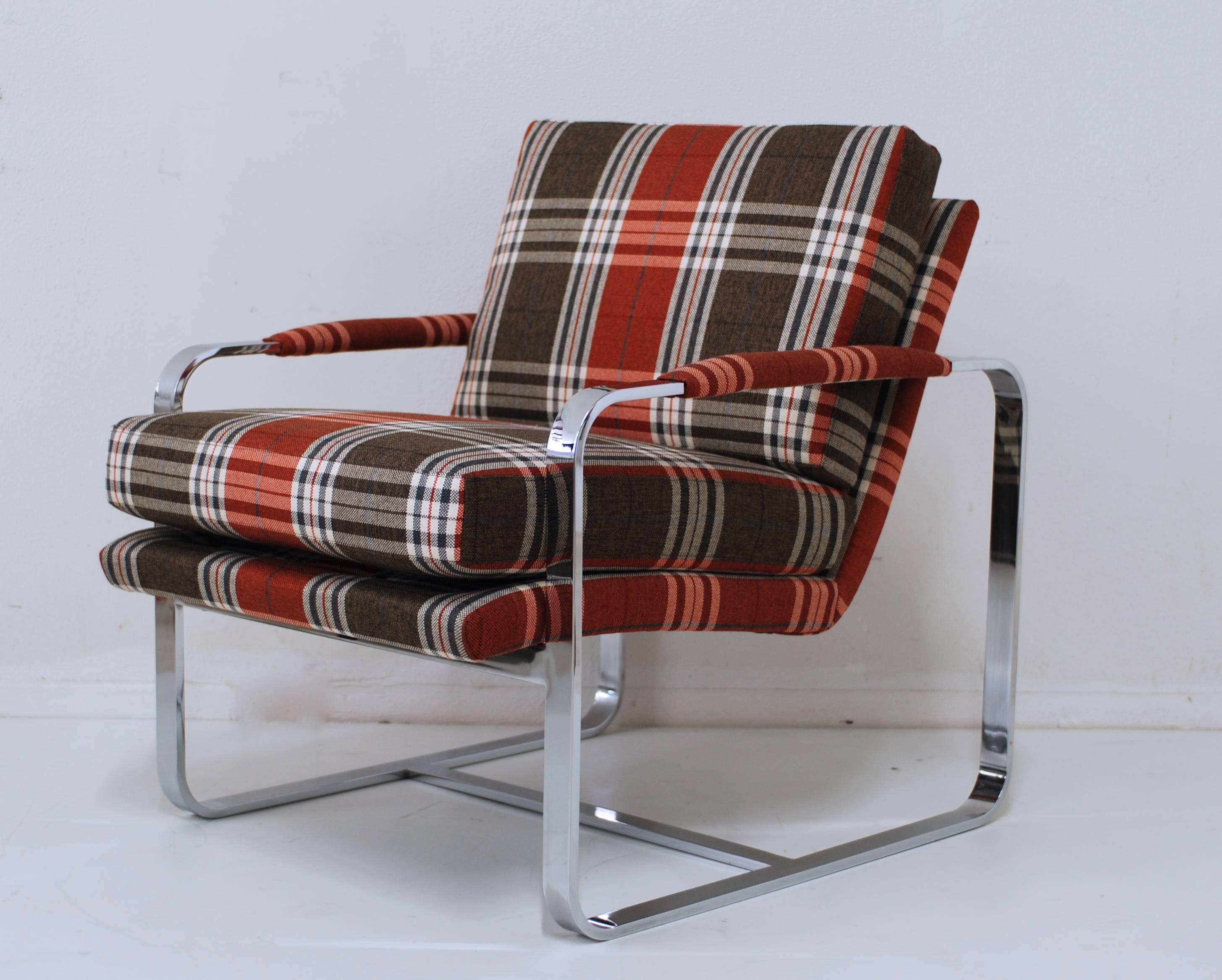 For Alexander McQueen tartan was an important fabric, it symbolized his Scottish heritage and it was a theme throughout his collections. This chrome lounge chair in the manner of Milo Baughman has been reupholstered and recovered with a fresh tartan