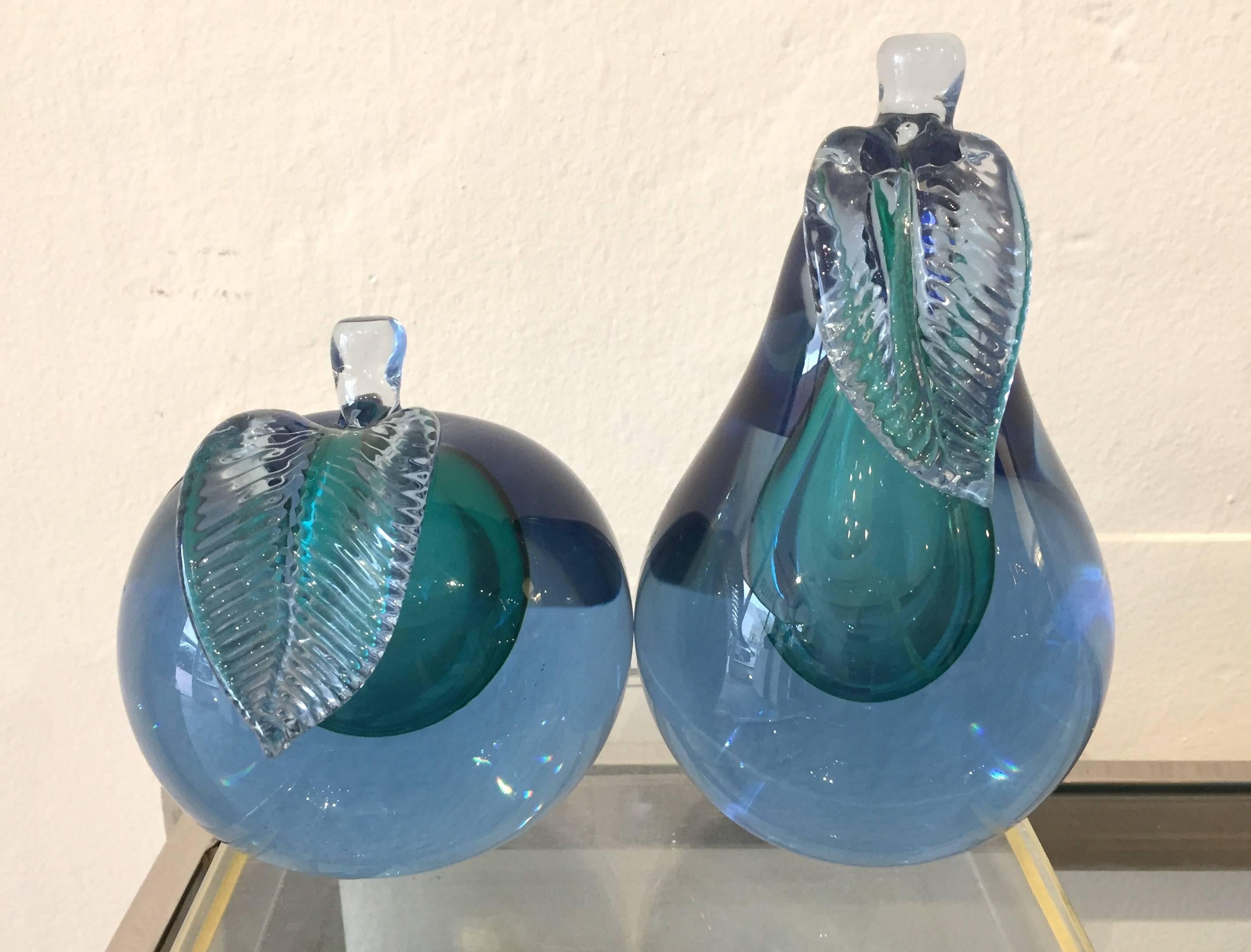 A beautiful apple and pear with blue encapsulating the green handblown glass. Measures: The pear is 7