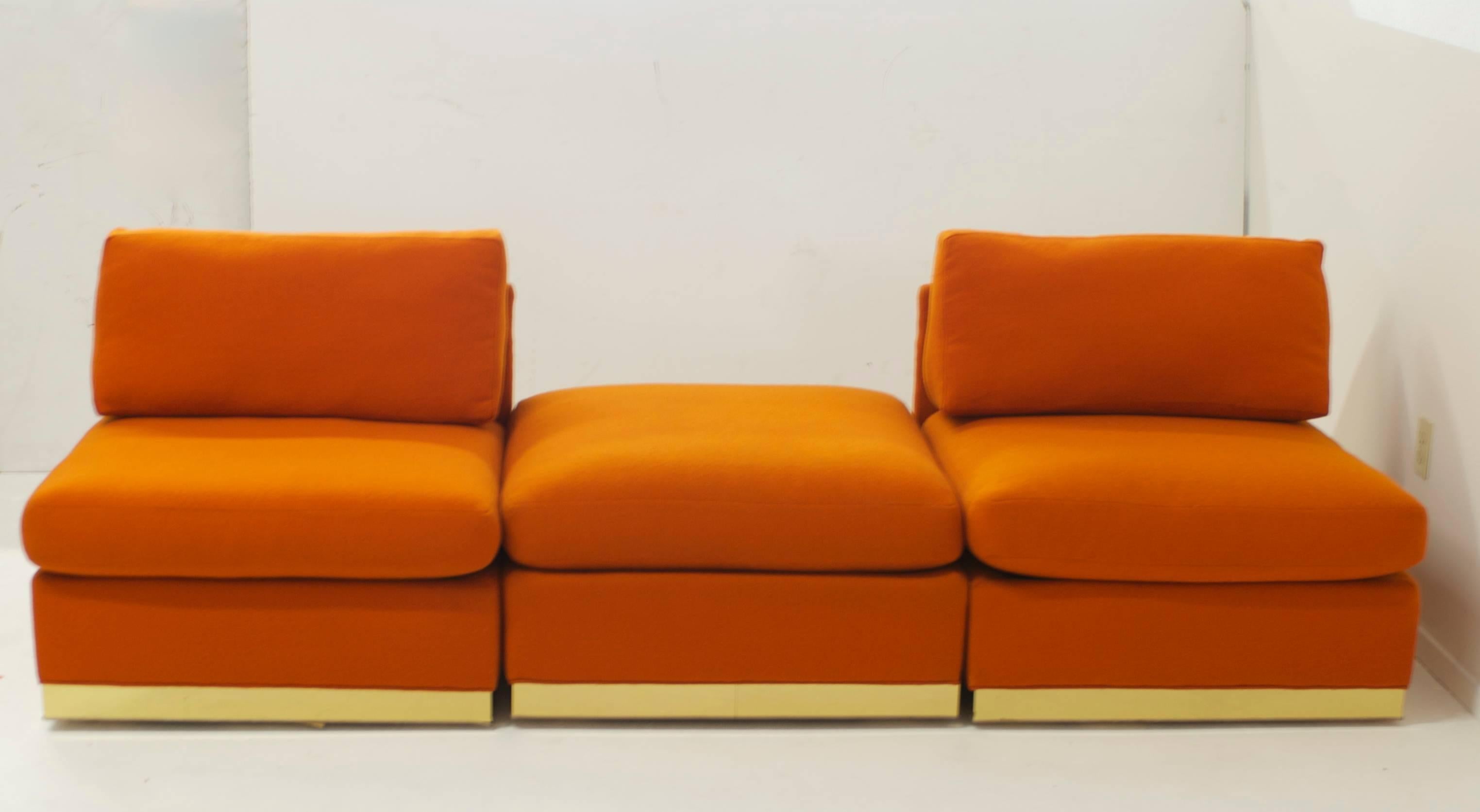 A seating group by Milo Baughman for Thayer Coggin in the original orange fabric. The set comprises of four armless slipper chairs two ottomans and two stools.
There sets of chairs are different but complementary. The set with the brass base have
