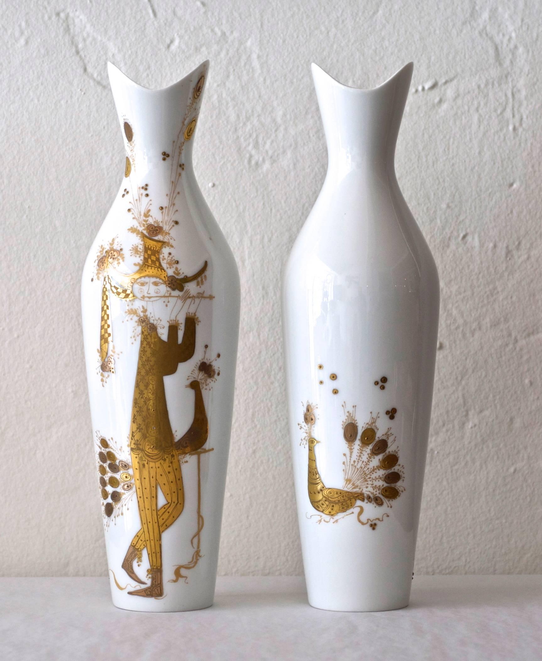 This whimsical pair of porcelain vases are hand-painted with gold. They are in excellent condition.