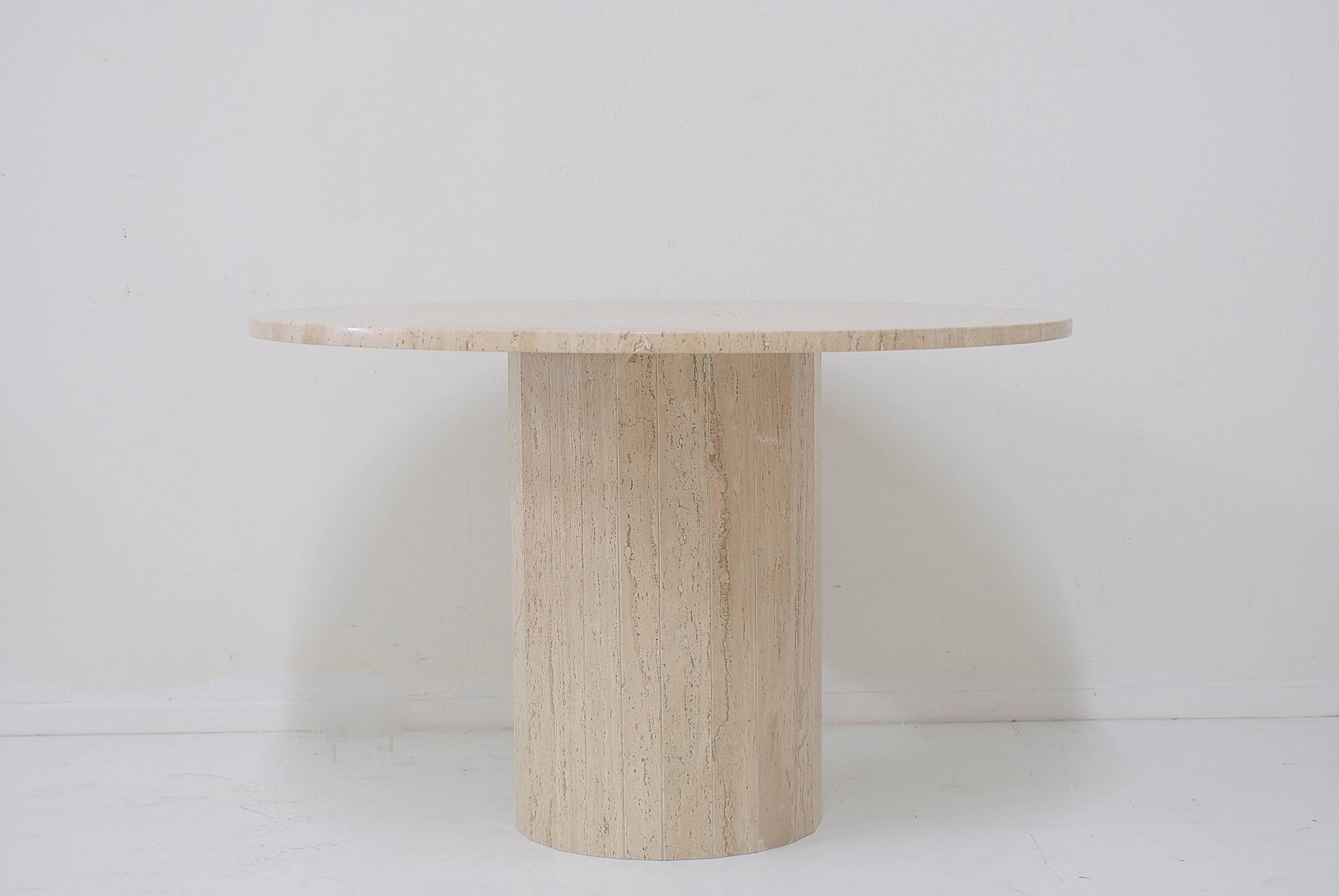 A modern Classic travertine table with gorgeous veining throughout. The 44