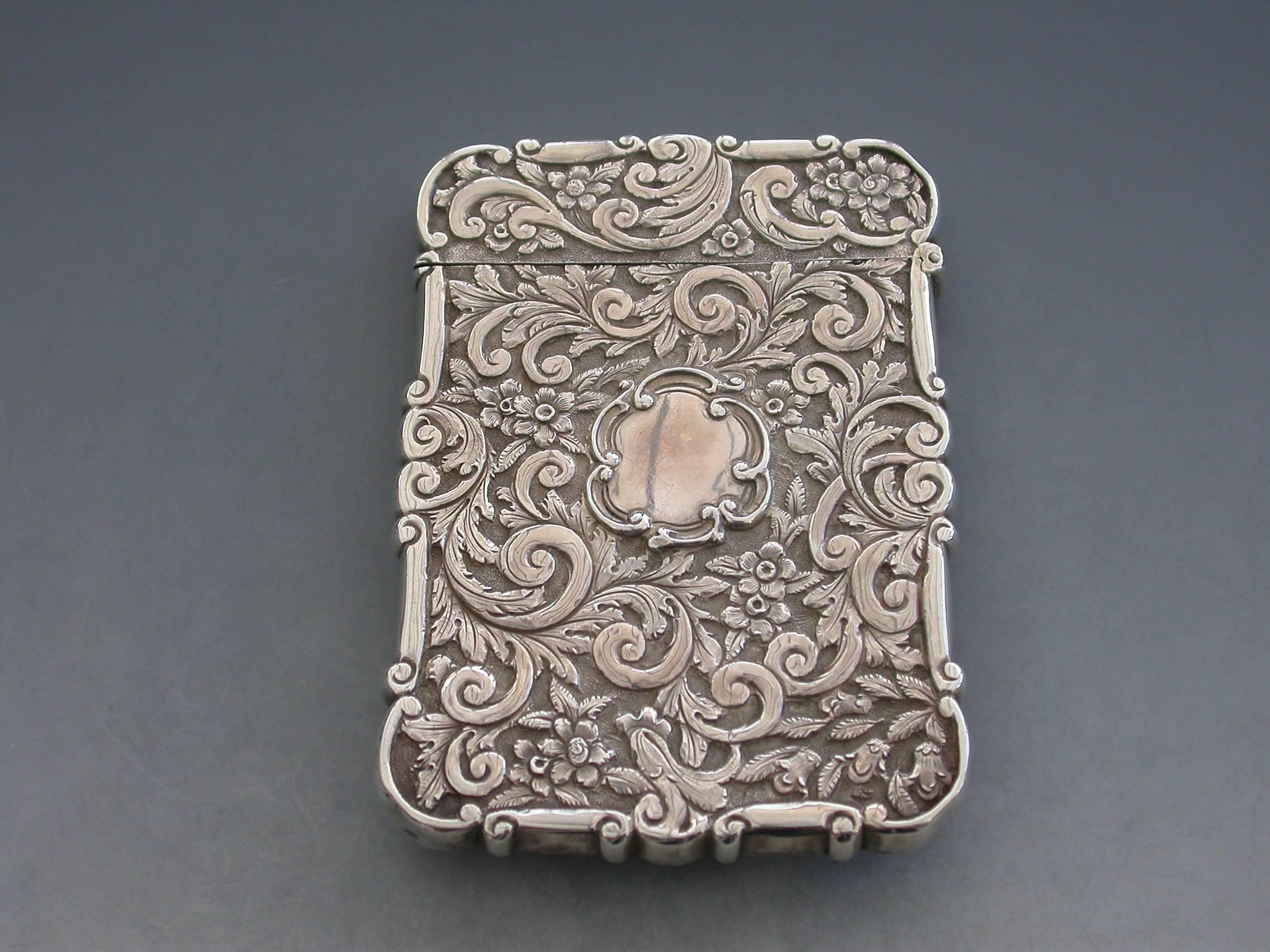 A rare Victorian silver castle-top card case of shaped rectangular form with chased and embossed foliate scroll decoration, the front with a scene depicting Osborne House in high relief. The reverse with a vacant shaped cartouche.

By Edward