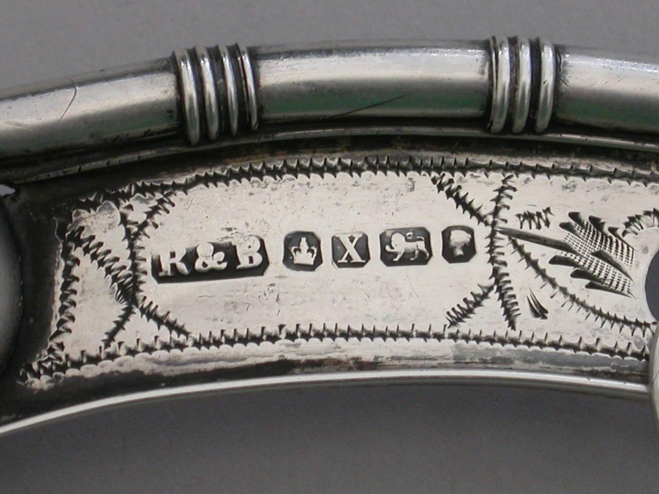 A Victorian silver Bosuns Whistle (or boatswain whistle), the buoy stamped on either side with the royal navy crown and anchor mark, the keel with scratch engraved decoration and a vacant cartouche, reeded bands to the pipe. Complete with suspension