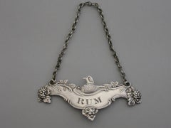 George III Irish Silver Jug and Bottle Wine Label 'Rum', circa 1810