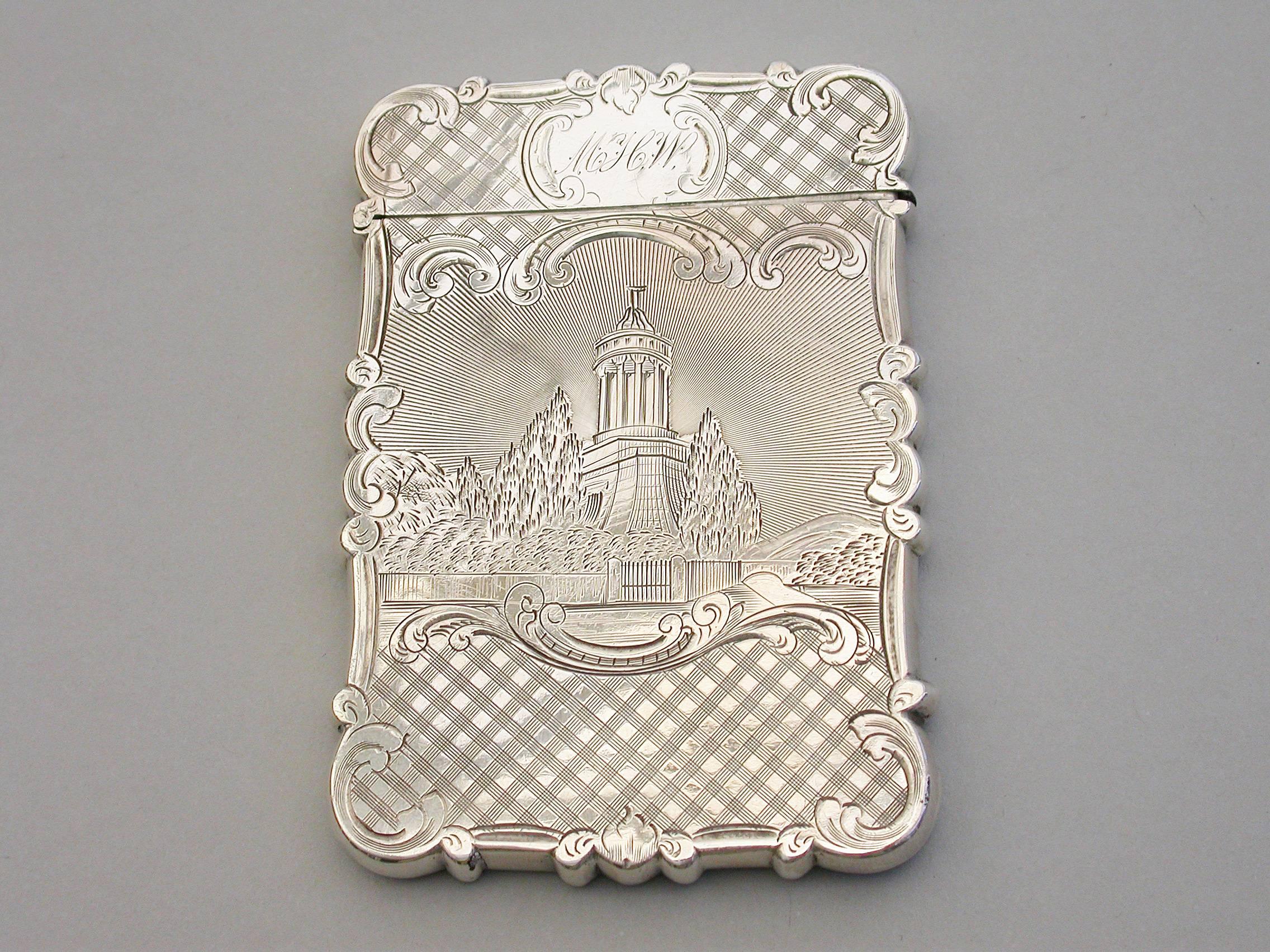A rare Victorian silver double sided castle-top card case of shaped rectangular form with hinged lid, the back and front with tartan style decoration surrounding shaped cartouches, one depicting Burns Monument in Scotland and the other depicting