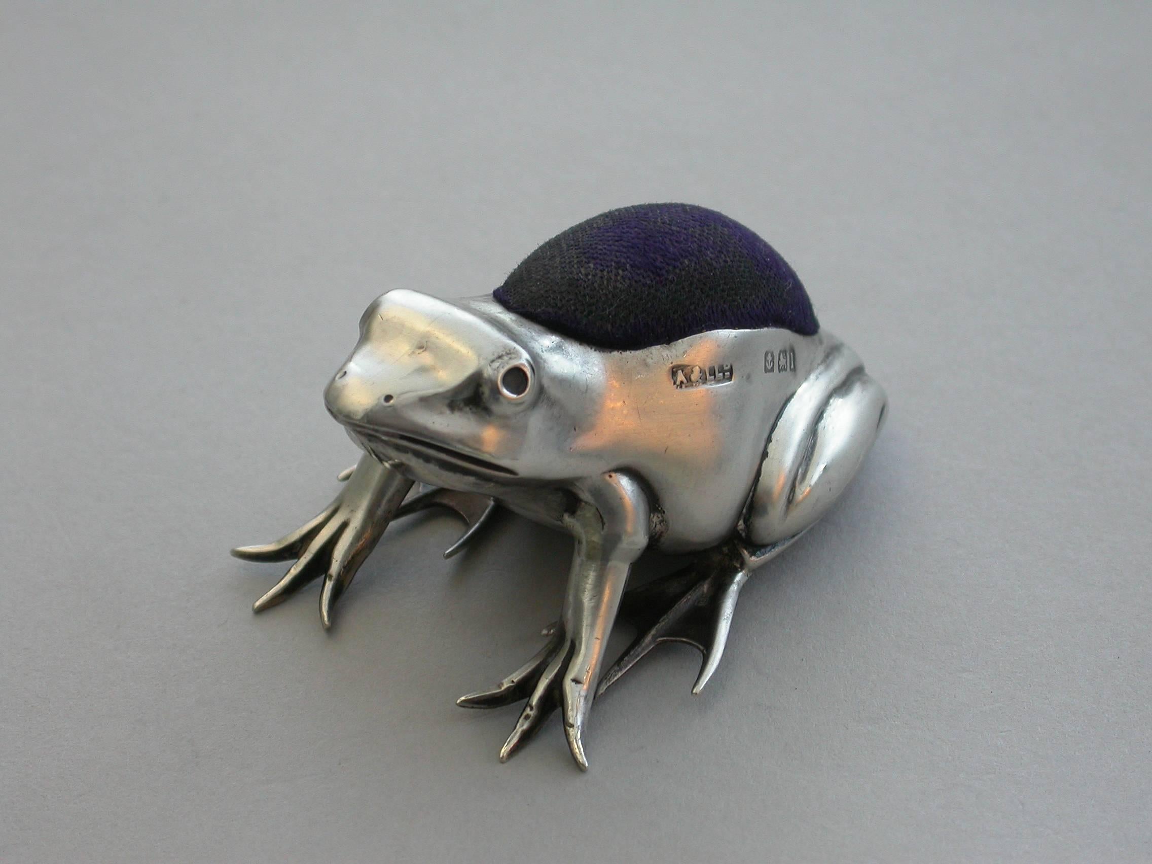 A good Edwardian novelty silver Pin Cushion made in the form of a crouching frog.

By Adie & Lovekin, Birmingham, 1910

In good condition with no damage or repair and complete with original cushion.
Measures:
Height 28 mm (1.10 inches)
Width