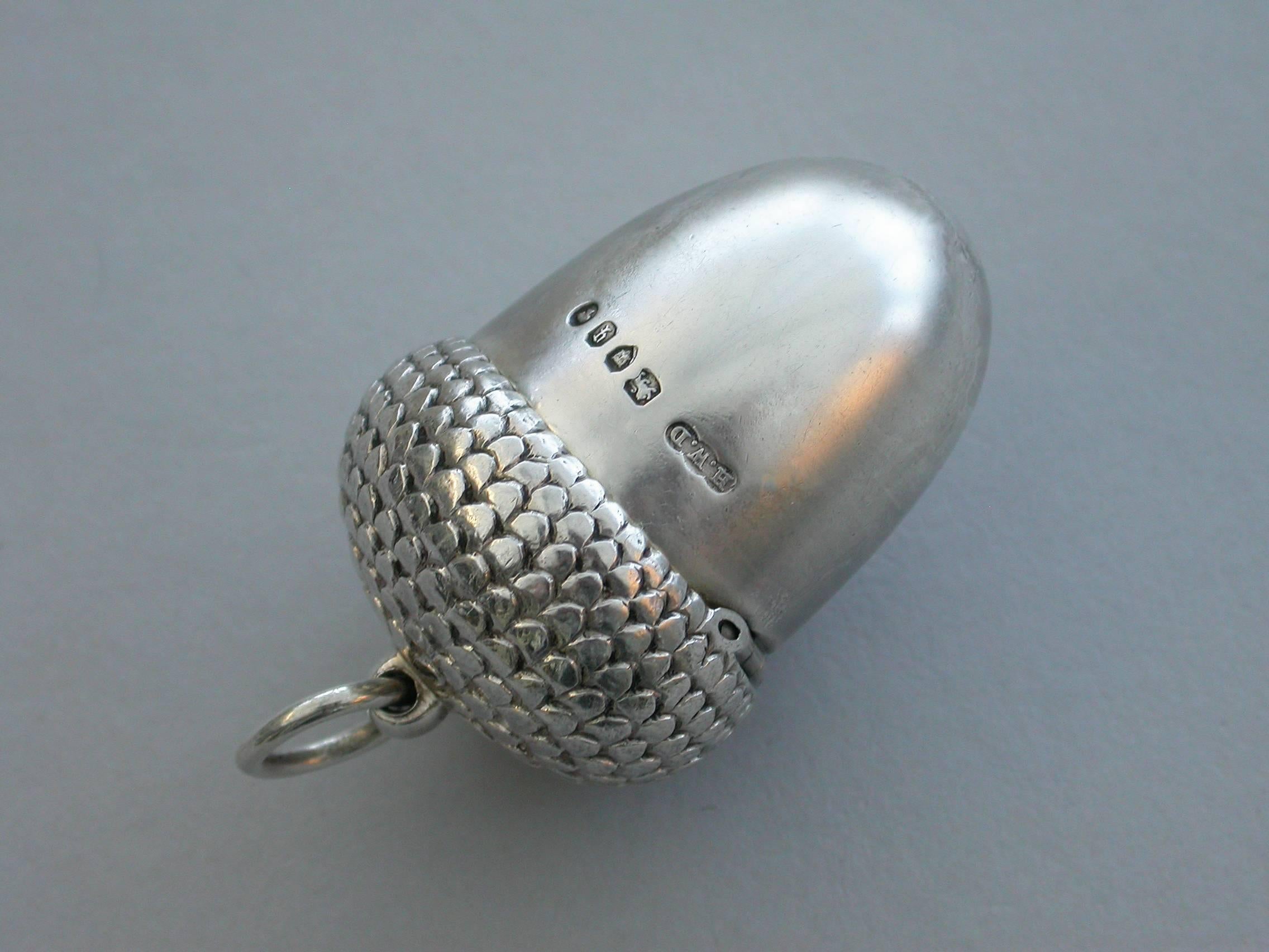 A good Victorian novelty silver Vinaigrette made in the form of an Acorn, the chased cup forming the cover with attached suspension ring, the body perfectly plain and forming the nut. The silver gilt interior with pierced hinged grille with Celtic