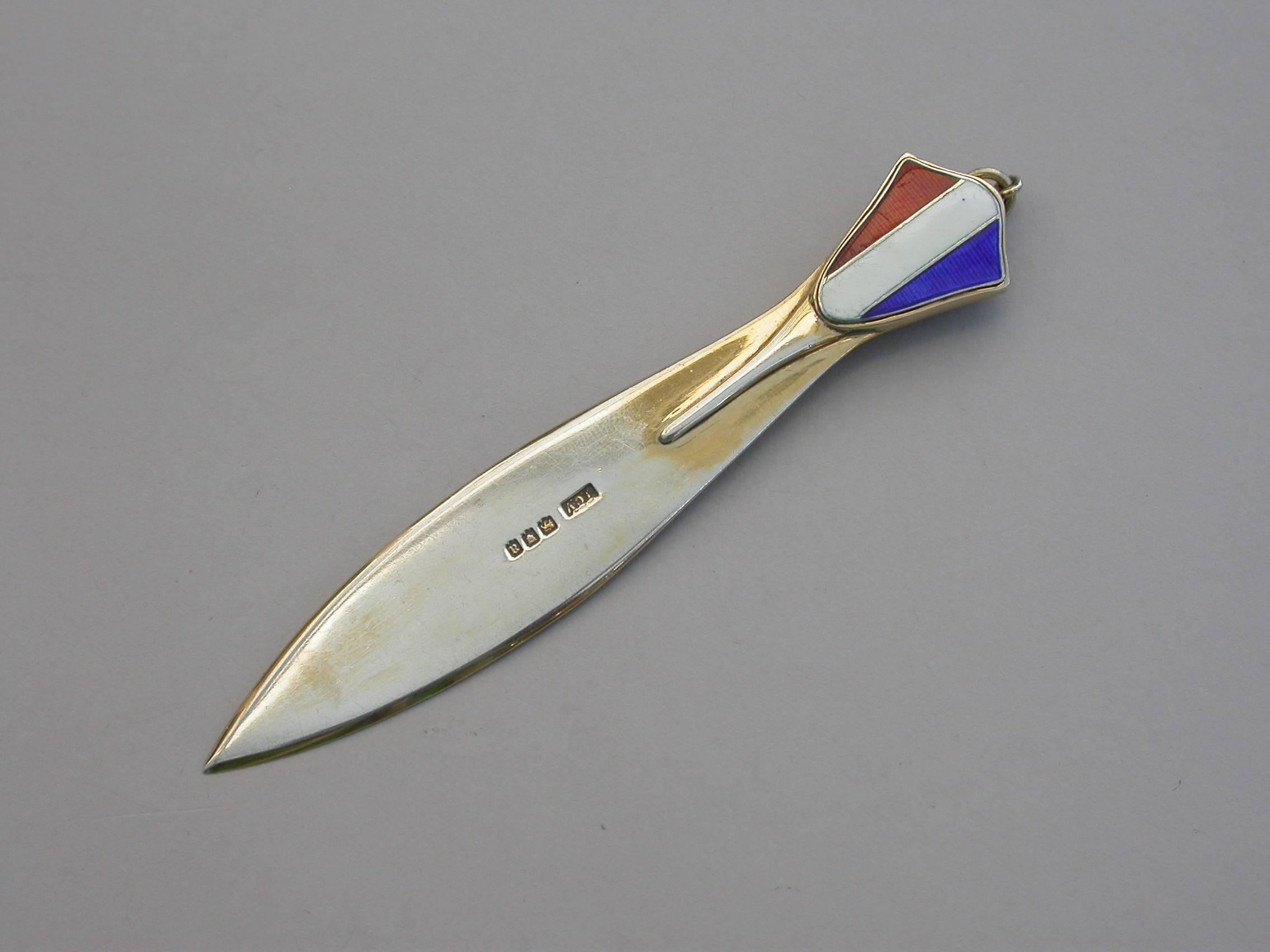 A very fine and rare George V silver gilt and enamel bookmark with propeller shaped blade, the shield shaped terminal enamelled with the French tricolour flag. The reverse with attached silver gilt propelling pencil.

By J C Vickery, London,
