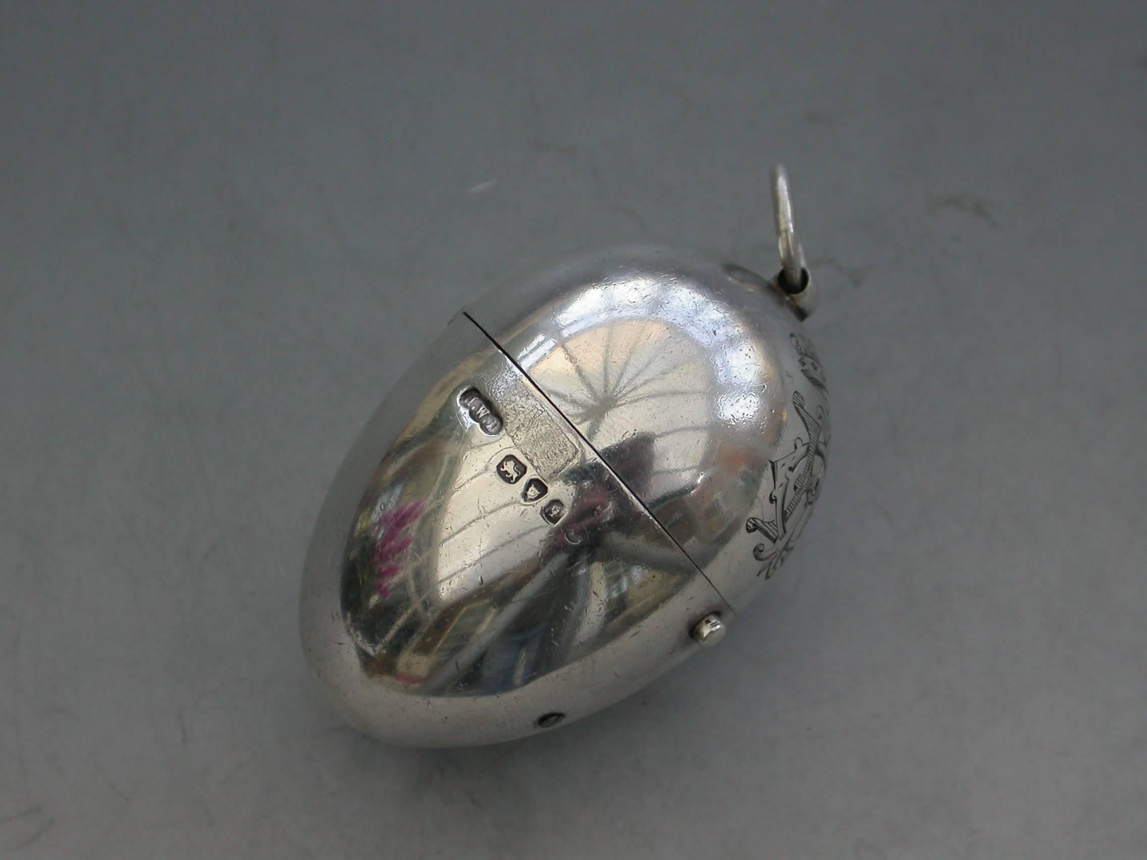 A very fine Victorian silver egg shaped Sewing Etui, the plain silver body engraved with a Viscount's Coronet and Cypher, a push button mechanism to the hinged lid opening to reveal the silver gilt interior complete with a contemporary silver