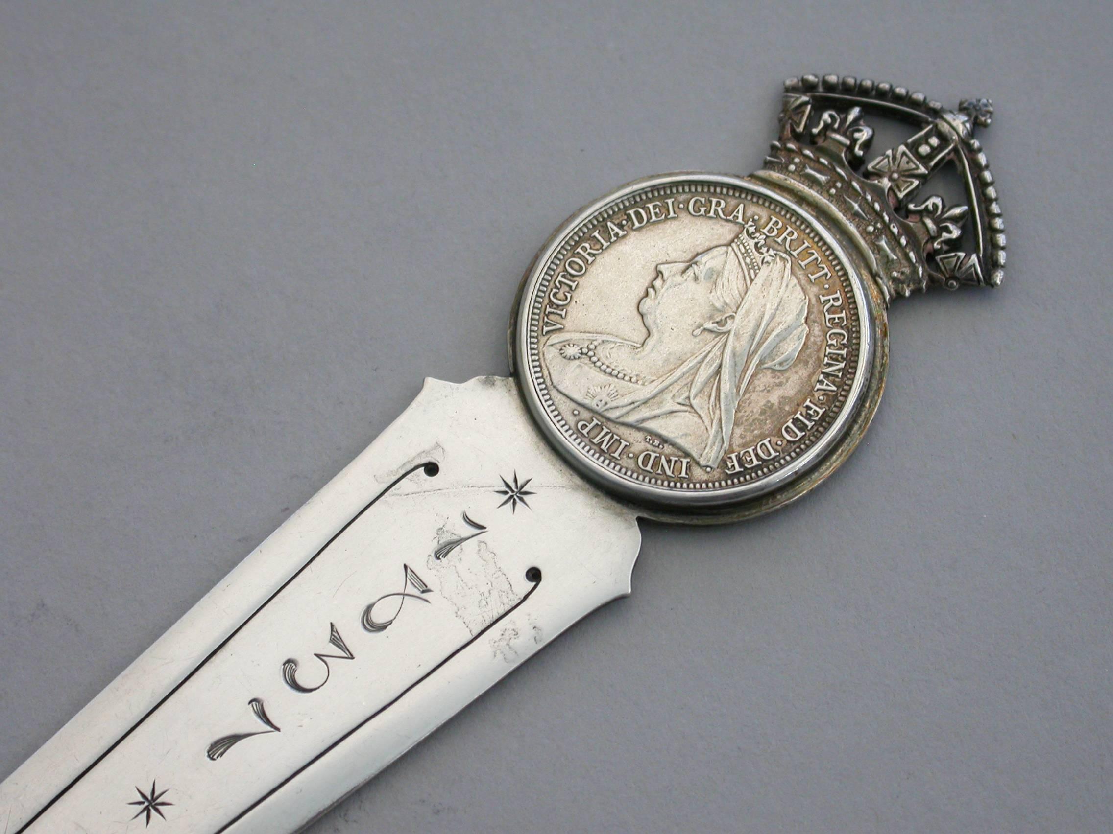 A superb large Victorian silver bookmark, made to commemorate the 60th anniversary of the coronation of Queen Victoria in 1837 and her Diamond Jubilee in 1897. The long tapering blade engraved with the dates 1837–1897. The circular mount set with a