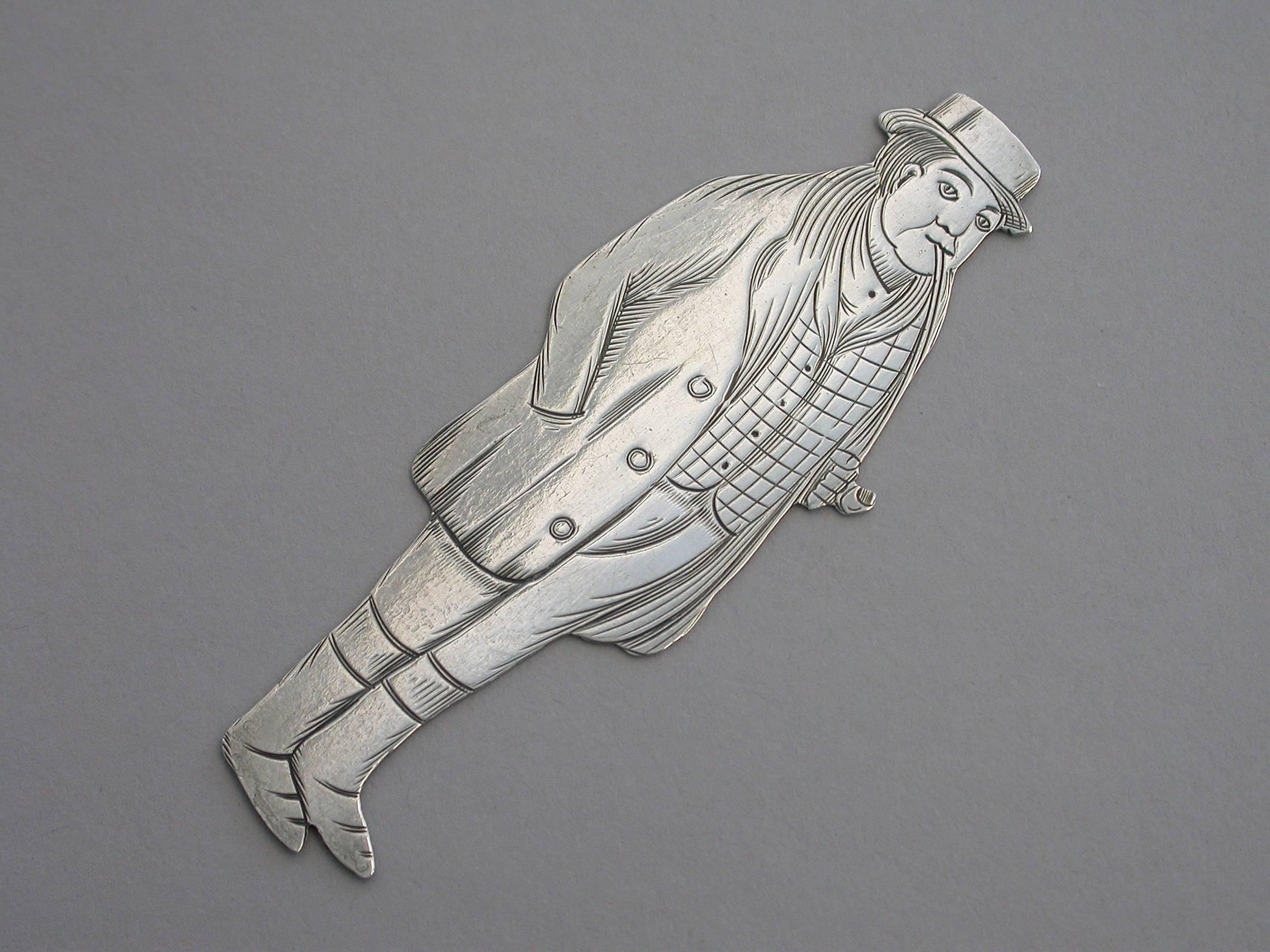 A rare early 20th century American novelty silver figural bookmark, depicting the character Tony Weller, from the Charles Dickens novel The Pickwick Papers.

By J F Fradley, New York, circa 1901-1910.

Note: No cut-out slot for use as a