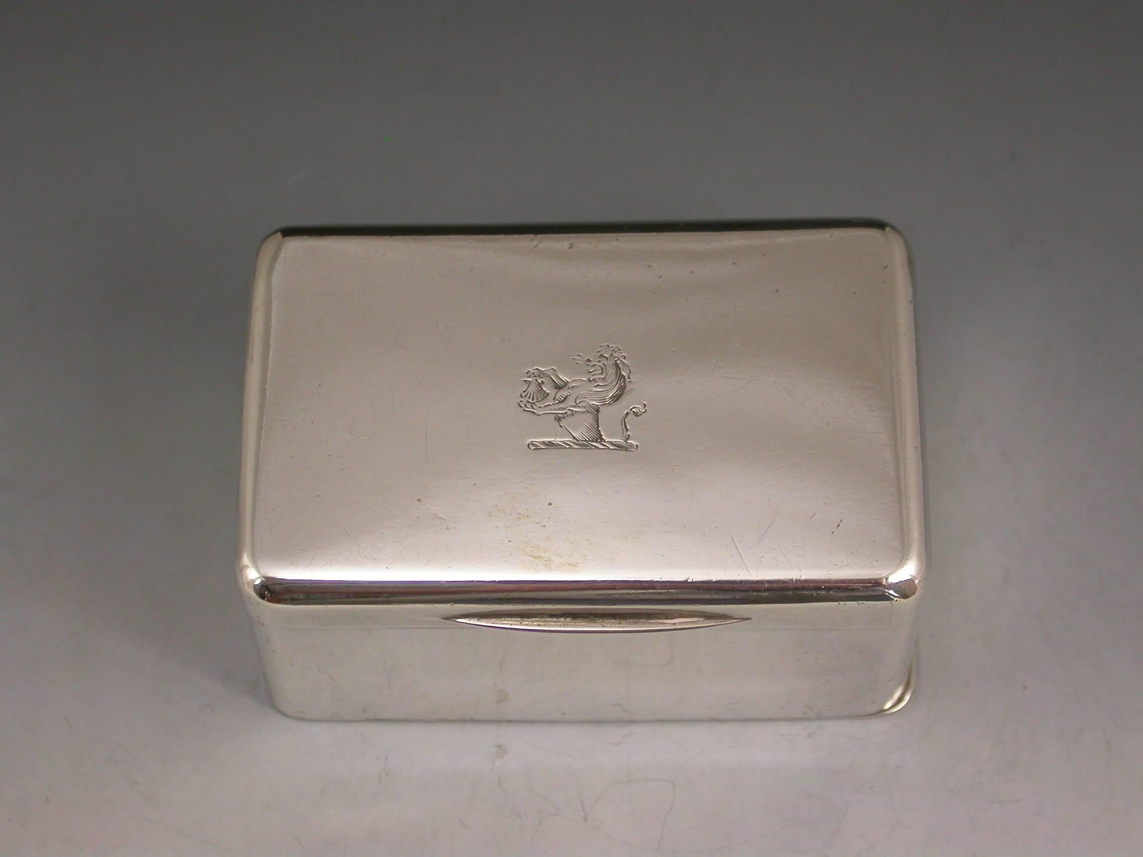 A huge George III silver nutmeg grater of plain rounded rectangular form, the hinged cover engraved with a crest depicting a demi-lion holding a scallop shell, the interior with original pierced steel grater and the base with flat concealed
