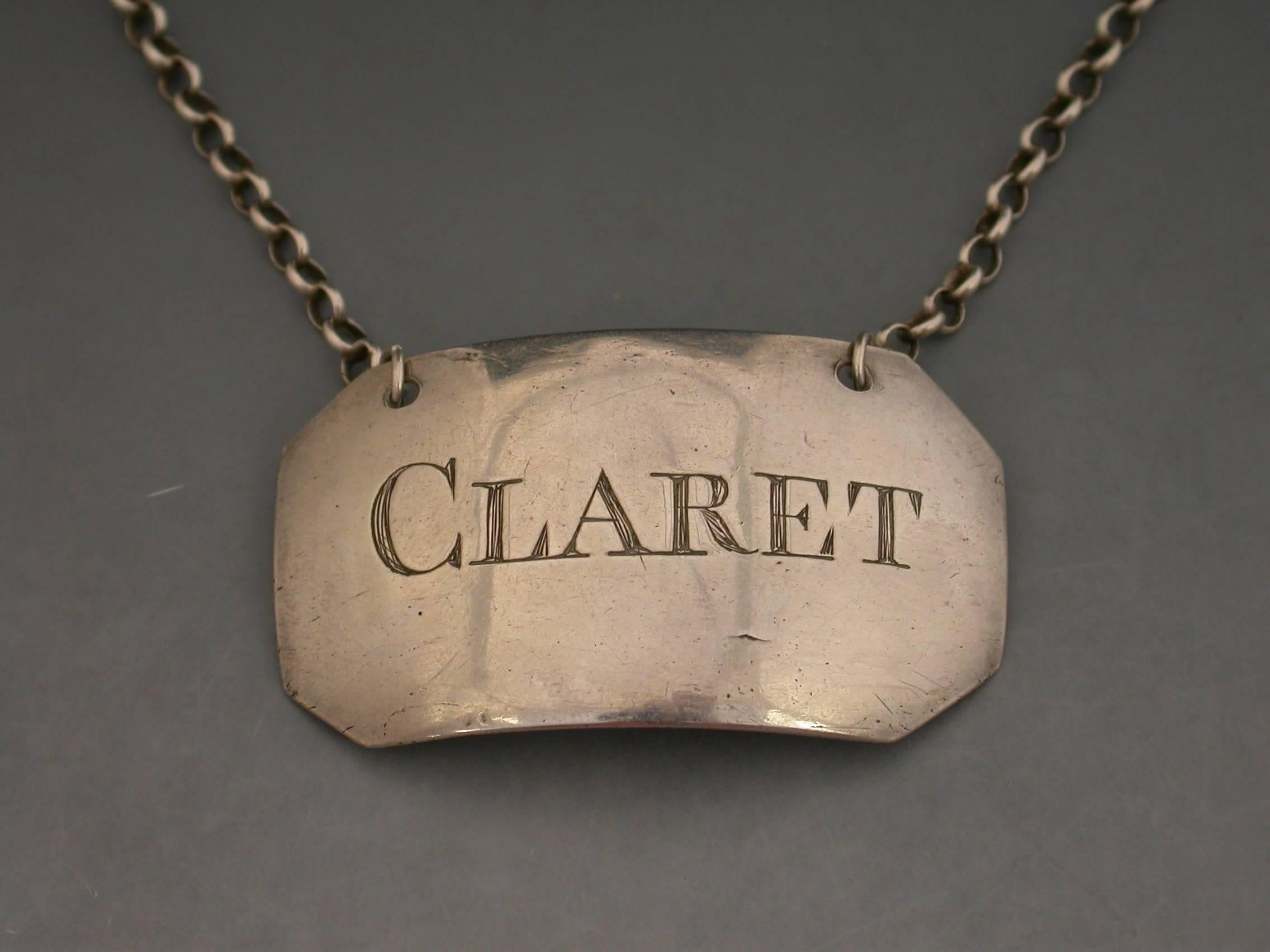 A George III silver wine label of plain broad rectangular form with cut-corners, incised for Claret. Possibly of Provincial origin.

Unmarked, circa 1790.

The larger capital letter 'C' in the title is characteristic of north country Wine