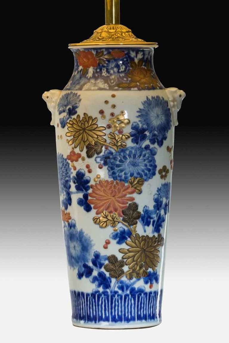 A pair of Meiji period Arita vases with overglaze polychrome and gilt chrysanthemums.