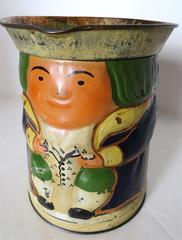 "Toby" Jug Still Bank and Biscuit Tin, circa 1910