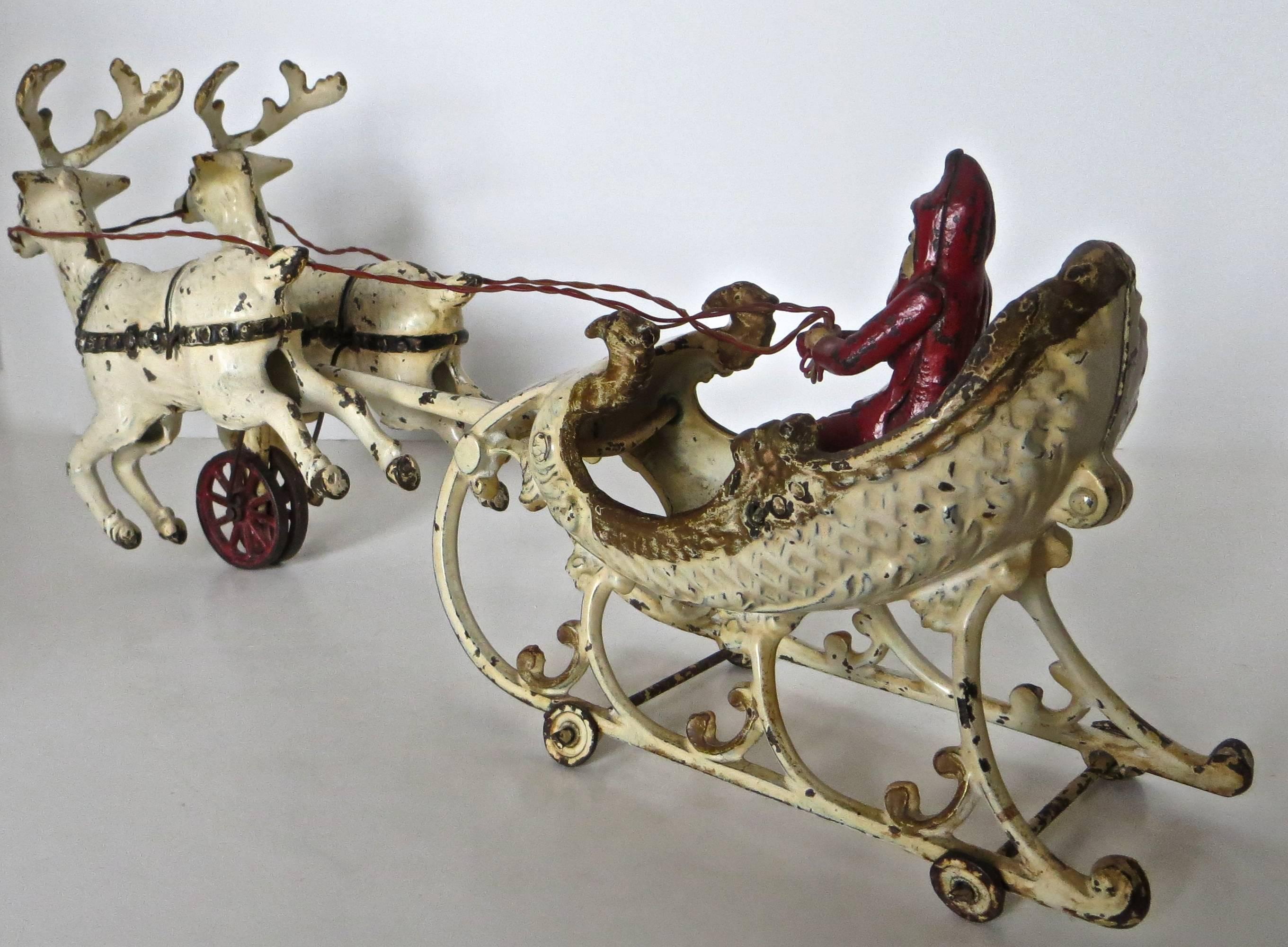 Cast Santa in the Sleigh with Two Reindeer by Hubley, circa 1900