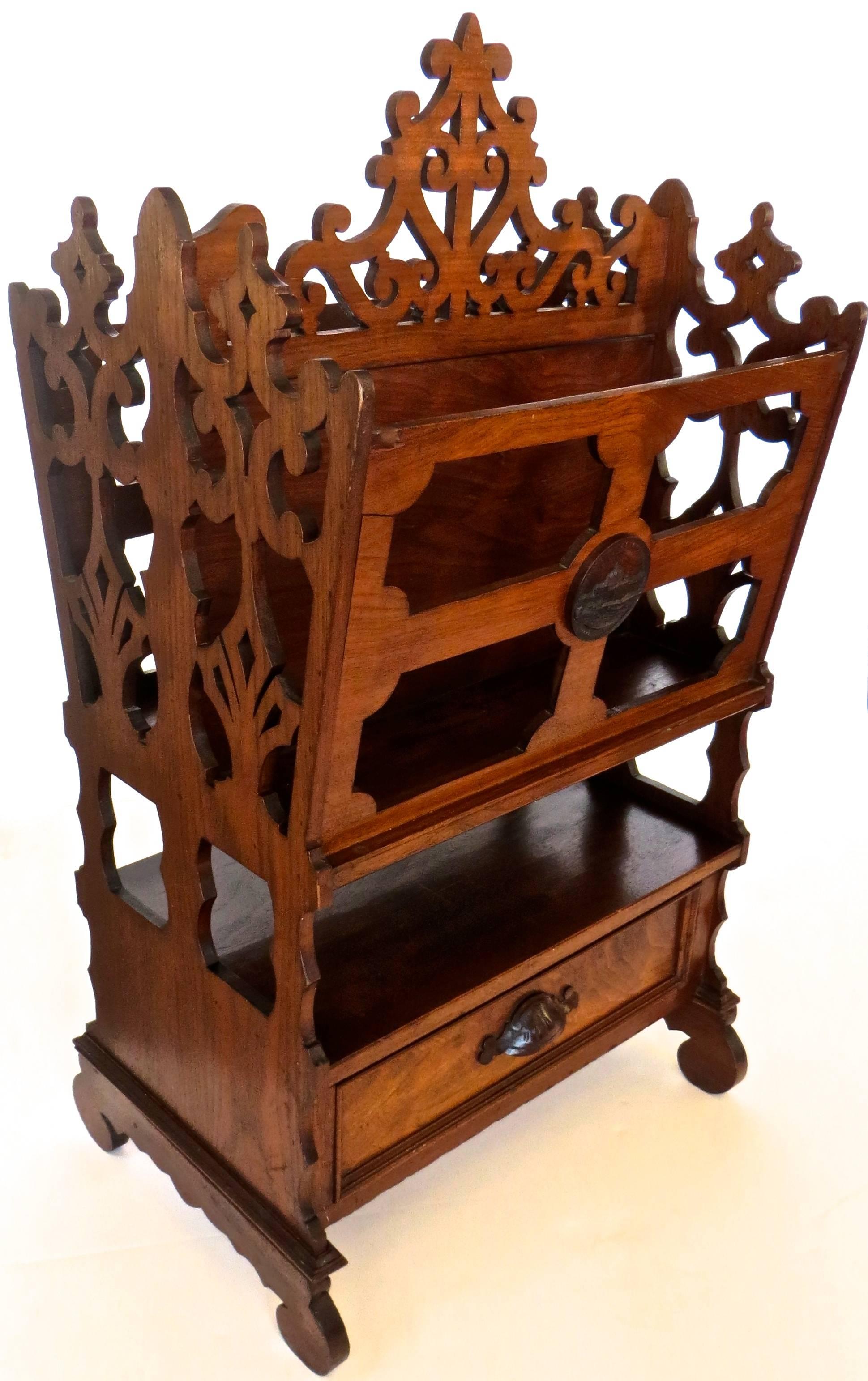 Fine quality American magazine rack (also known as a canterbury) exhibited at the Centennial Exhibition held in Philadelphia in 1876. Unusual to find an American example, as most are of English manufacture and quite ubiquitous. Of Charles Eastlake
