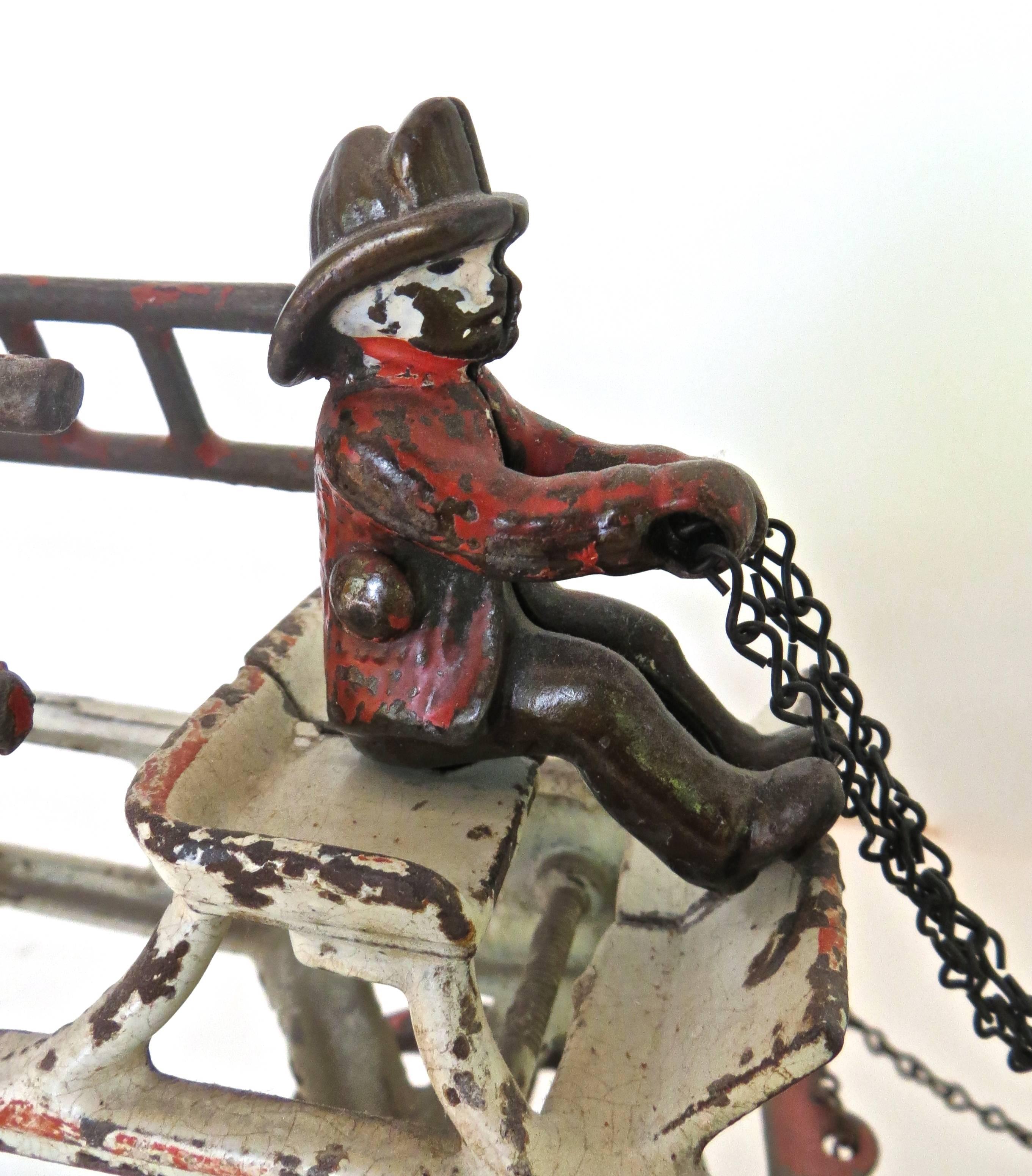 antique cast iron fire truck with horses