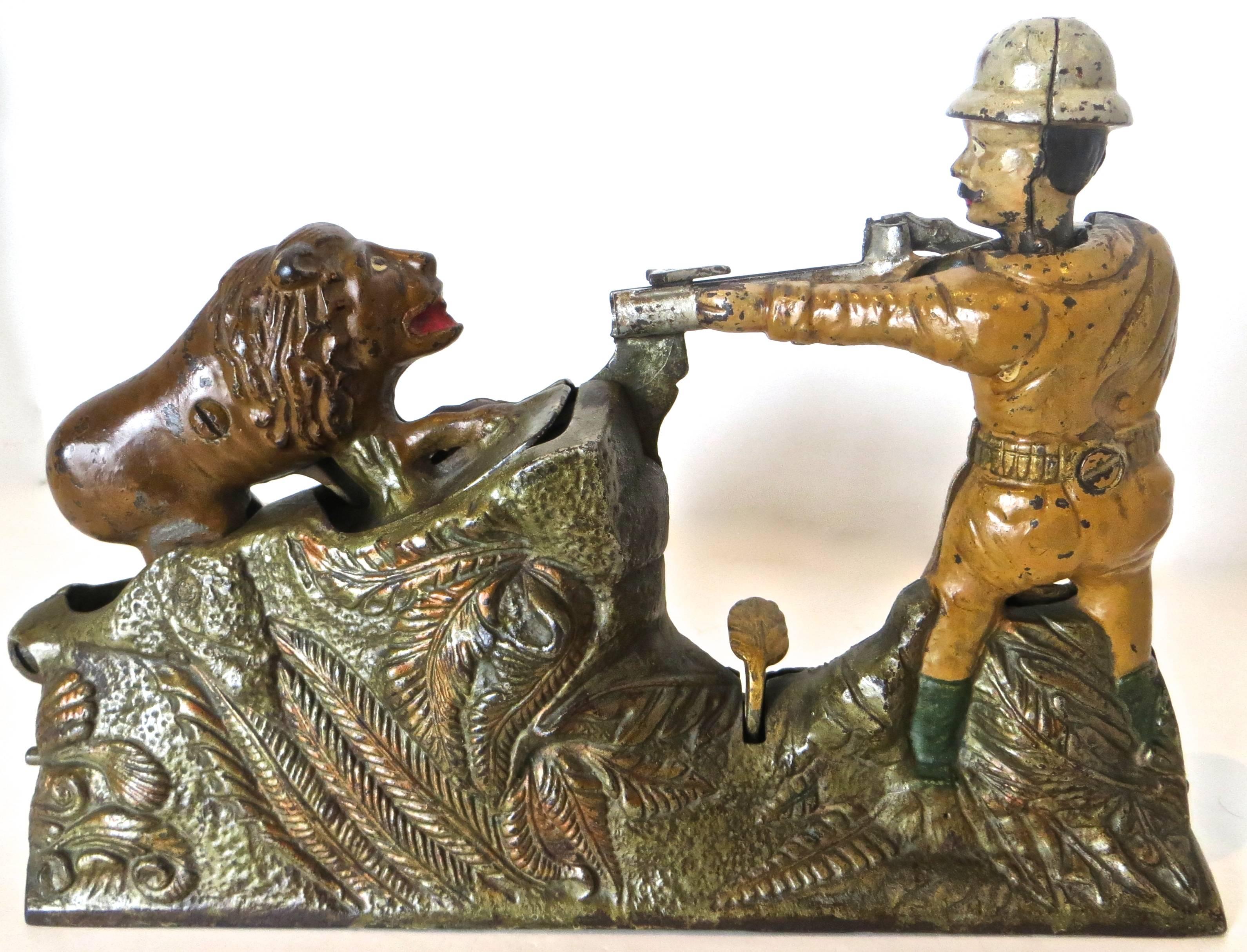 Manufactured in 1911 by the J. & E. Stevens Company in Cromwell, Connecticut, this rare cast iron mechanical bank purportedly depicts President Teddy Roosevelt aiming his rifle at a lion. Roosevelt is well-known for his affinity towards big game