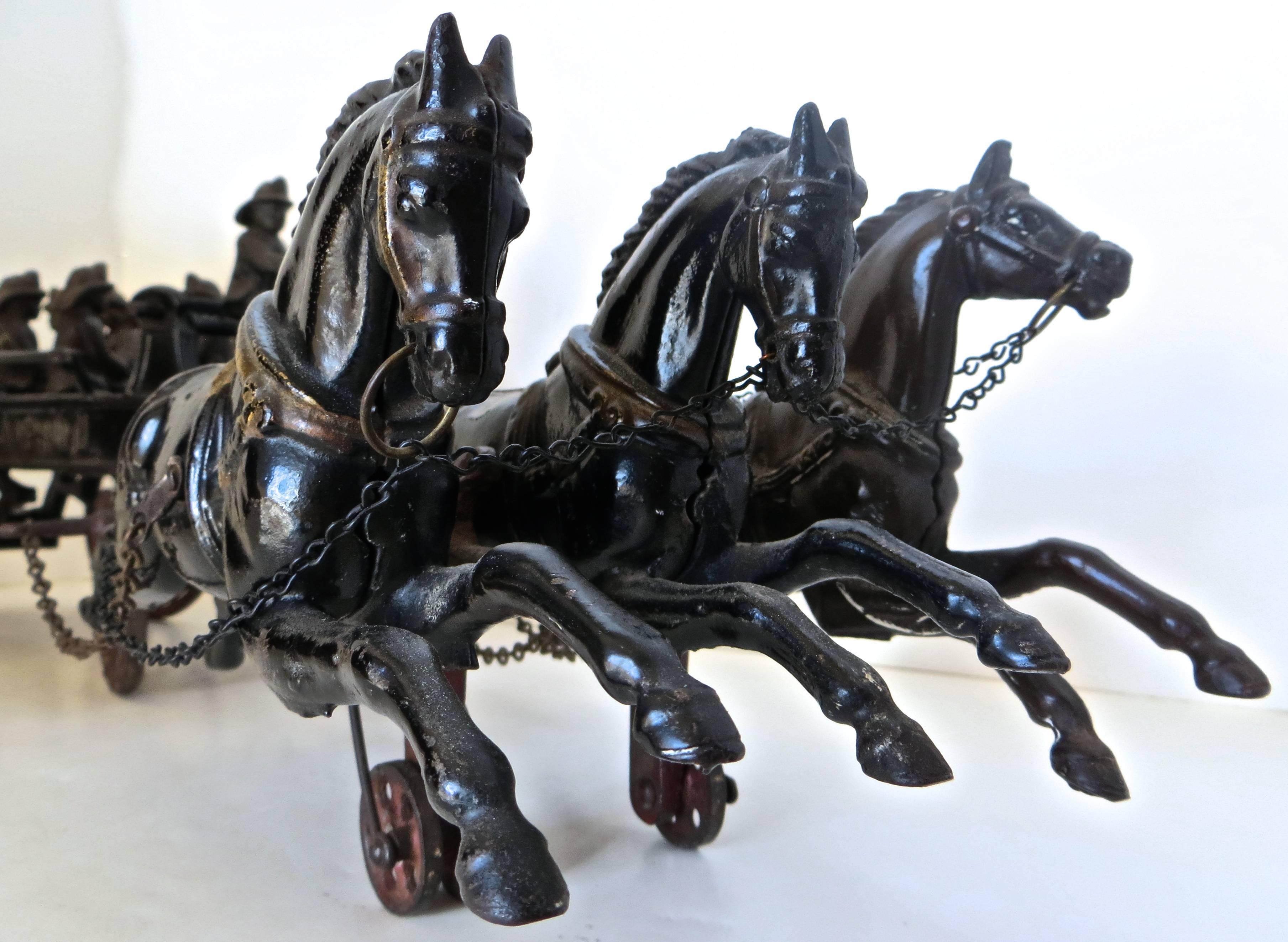 vintage cast iron horse drawn ladder fire truck