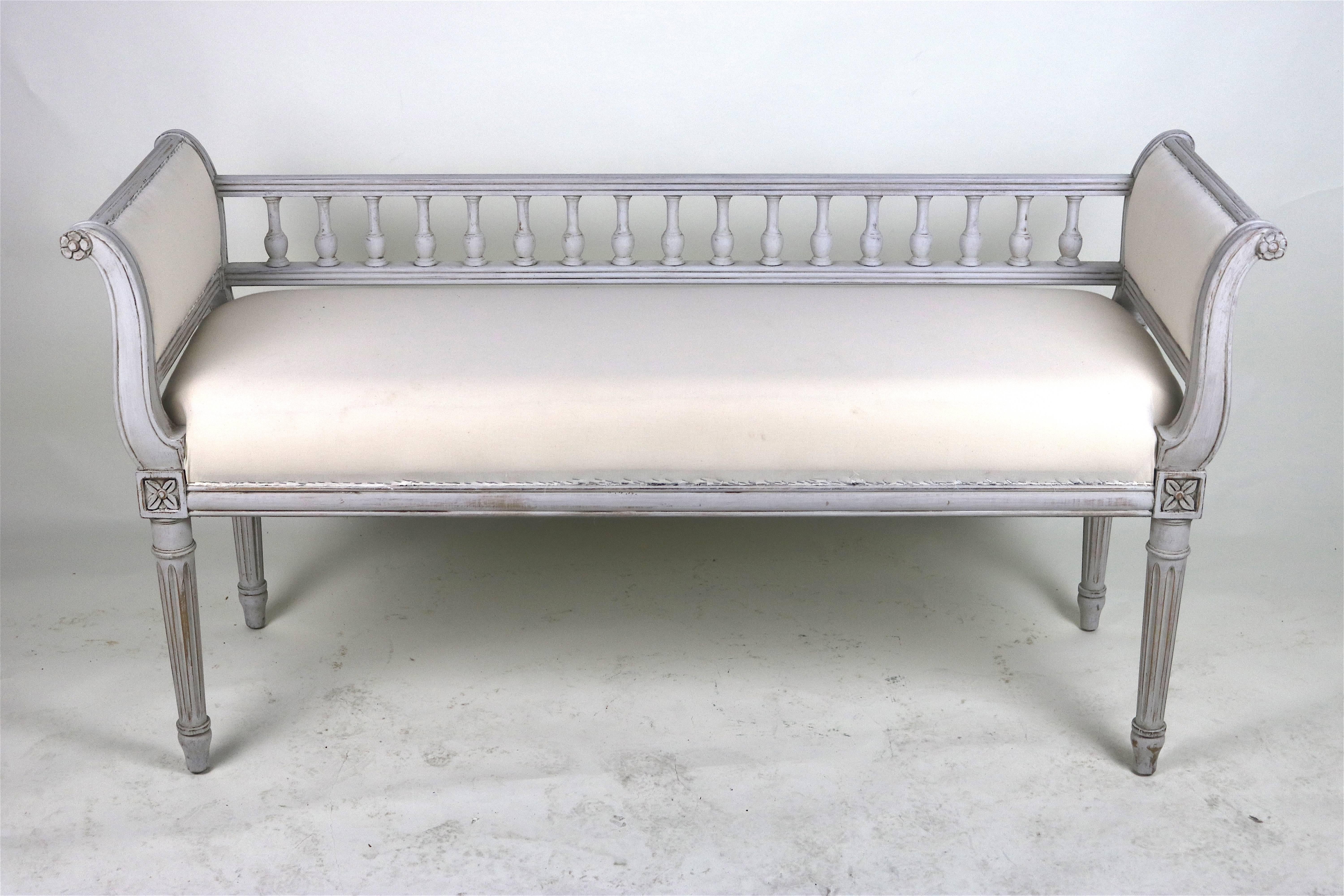 Rare lovely late 18th to early 19th century graceful Swedish Gustavian period carved painted wood bench with masterfully carved classical details lovely carved spindle back between curvilinear sides and carved legs with floral motif.
Beautiful aged