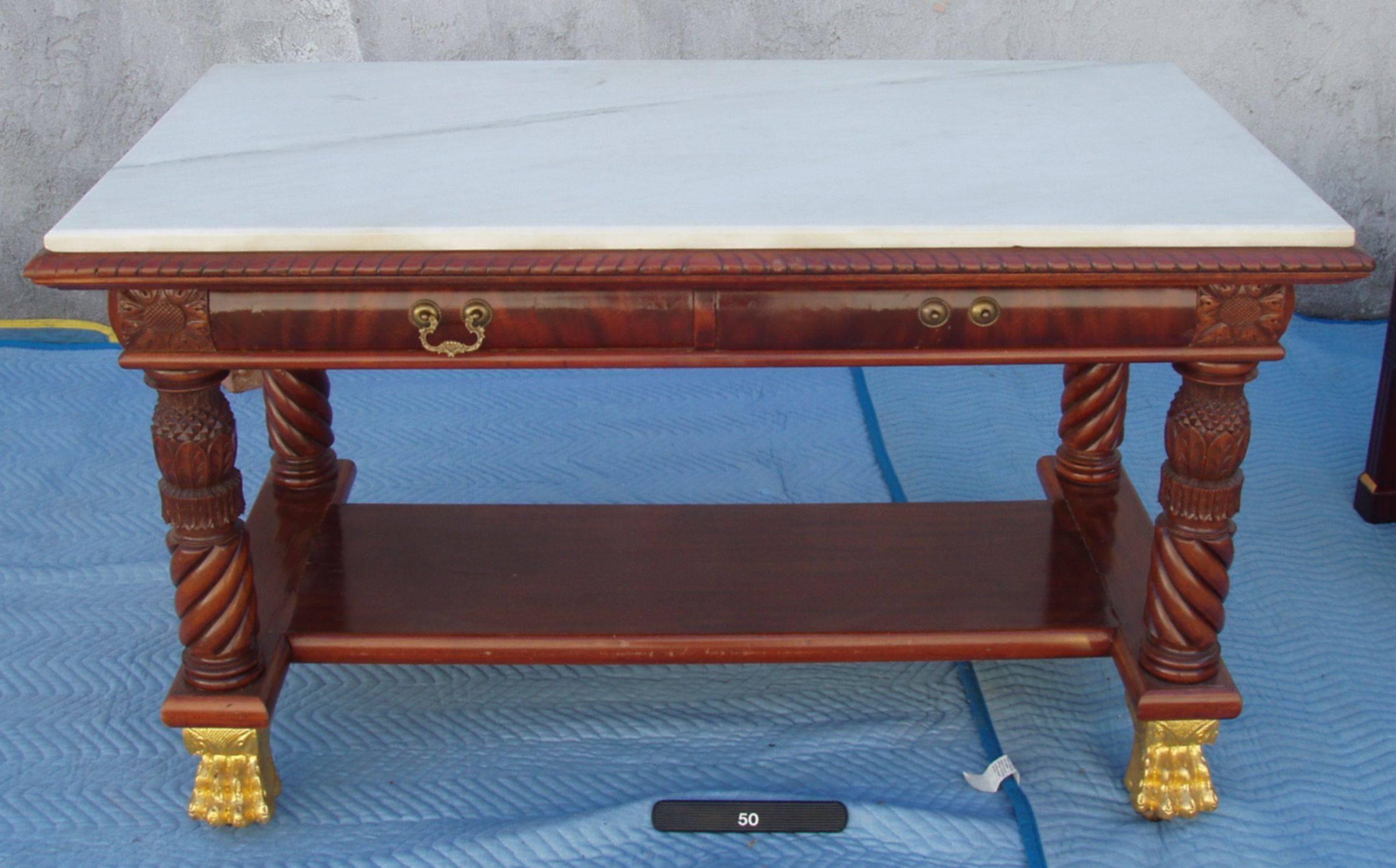 A superb early 19th century, American Federal style centre library table or desk or writing table-
a 'Tour de Force' American museum piece of quality and style.
Full figured mahogany with giltwood claw feet on recessed casters, finely carved legs