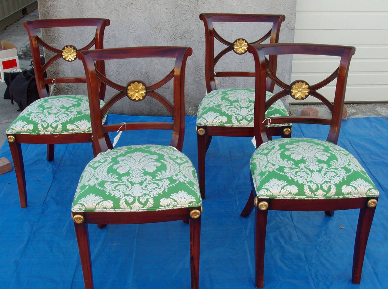 To the Manor born chairs, o if chairs were socialites, here they are!
High style highly detailed 19th century set of four Regency Klismos style mahogany chairs. We have not seen a more beautiful set of chairs of this style. Distinctive gold leaf