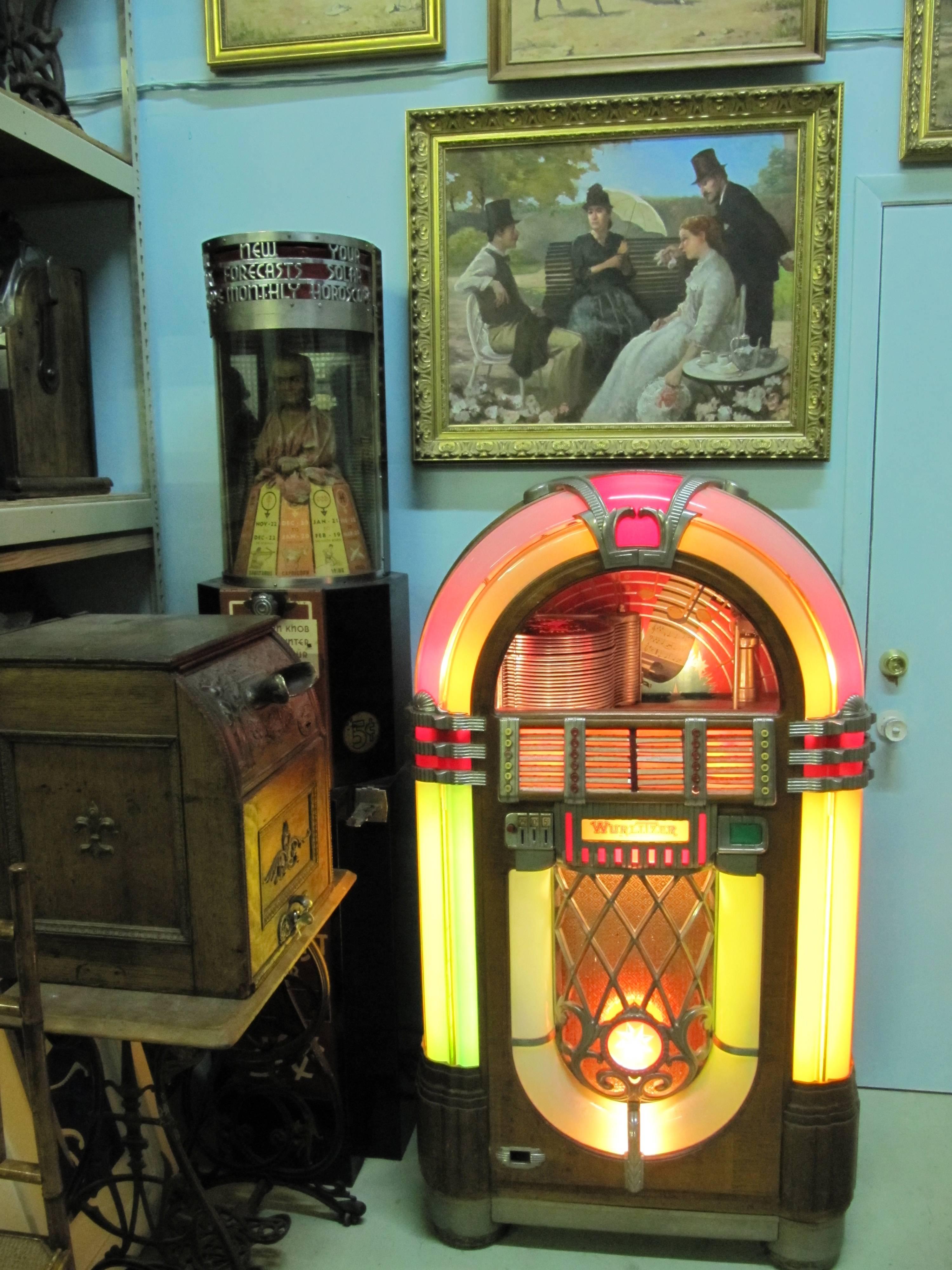 Cool jukebox made to impress!!
The case in nice original condition-mechanism has been reconditioned, plays 78 records and has the coolest true nostalgic sound. Select from A 24 stack of 78 record set on free play or play with coins to select your