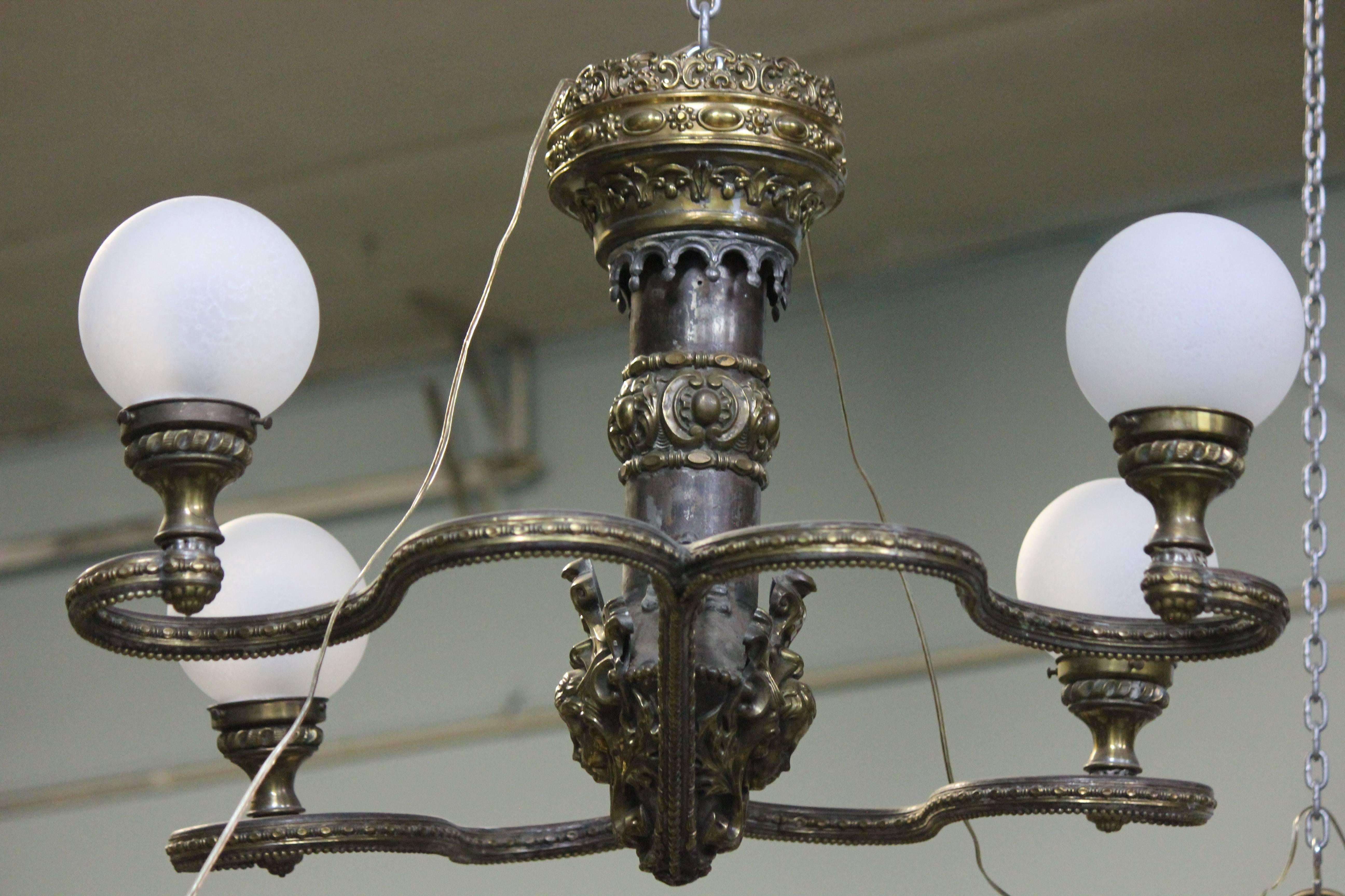 A Most Incredible, Rare, and Unique Highly Decorative Monumental Beaux Arts Belle Epoque Chandelier!!!- Four Volute Curvilinear Repousse Arms, Milk Glass Globes, Brass and Zinc Stem, Double Sided Repousse Putti and Elaborate Trim- Great Aged Patina